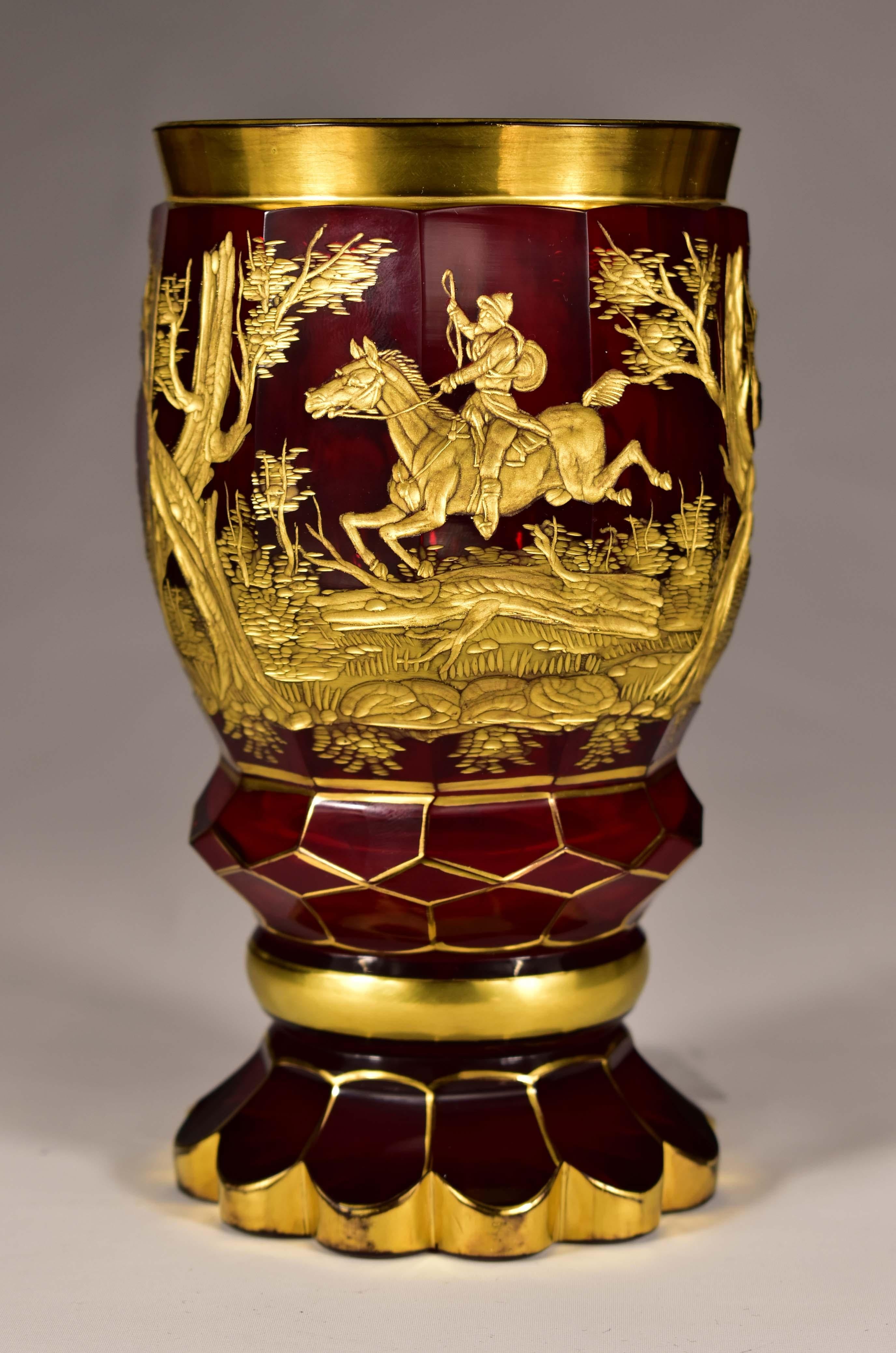A beautiful cut and engraved ruby Goblet. The goblet is faceted, Engraved hunting motif in 19th century style. The engraving is gilded, gilding was used to make the engraving stand out more.Gilding was exclusively used on colored goblets. The goblet