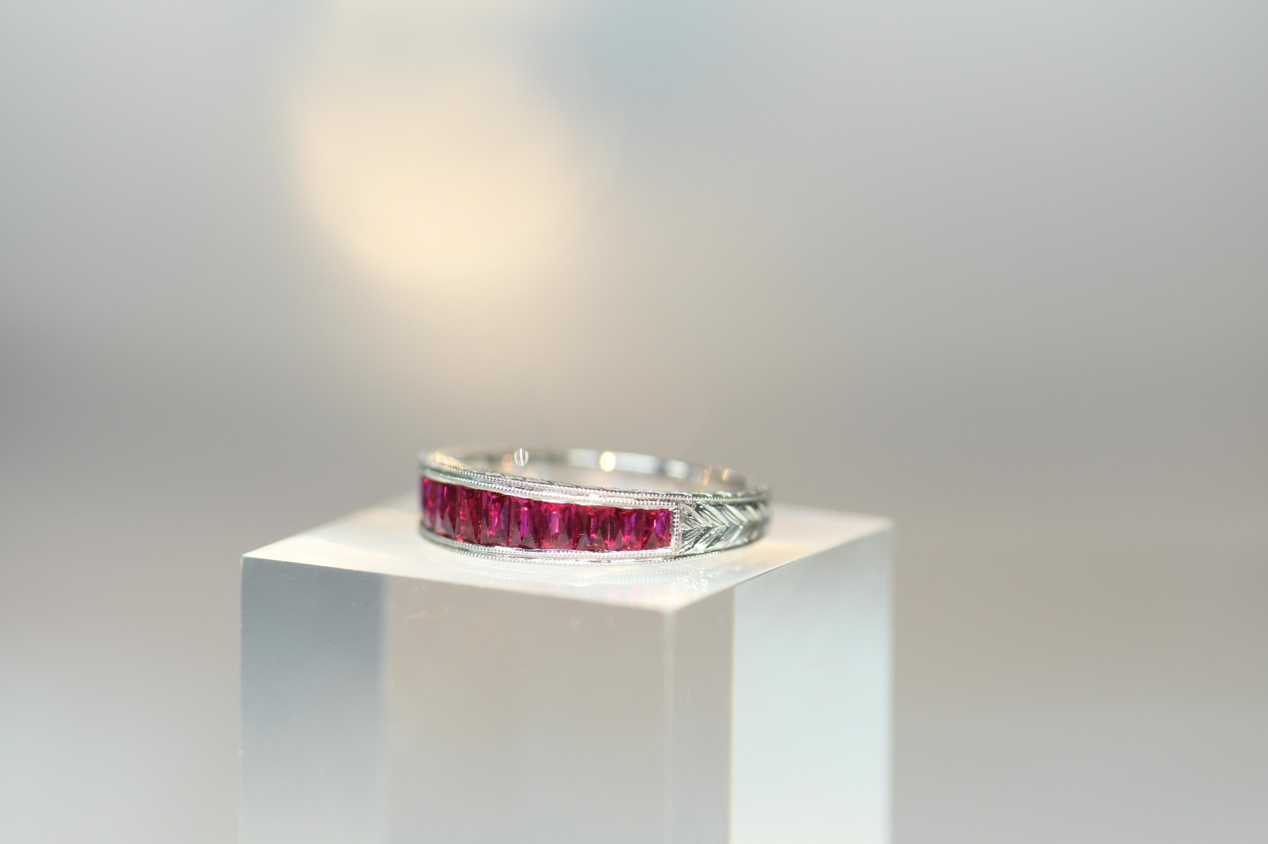 A lovely 18ct gold ring that has been set with well matched bright red natural ruby . The gold engrave work on the band is very fine and elegant.  This ring got an impressive look and very well matched stones. 

Weight: 4.93g
Size: N