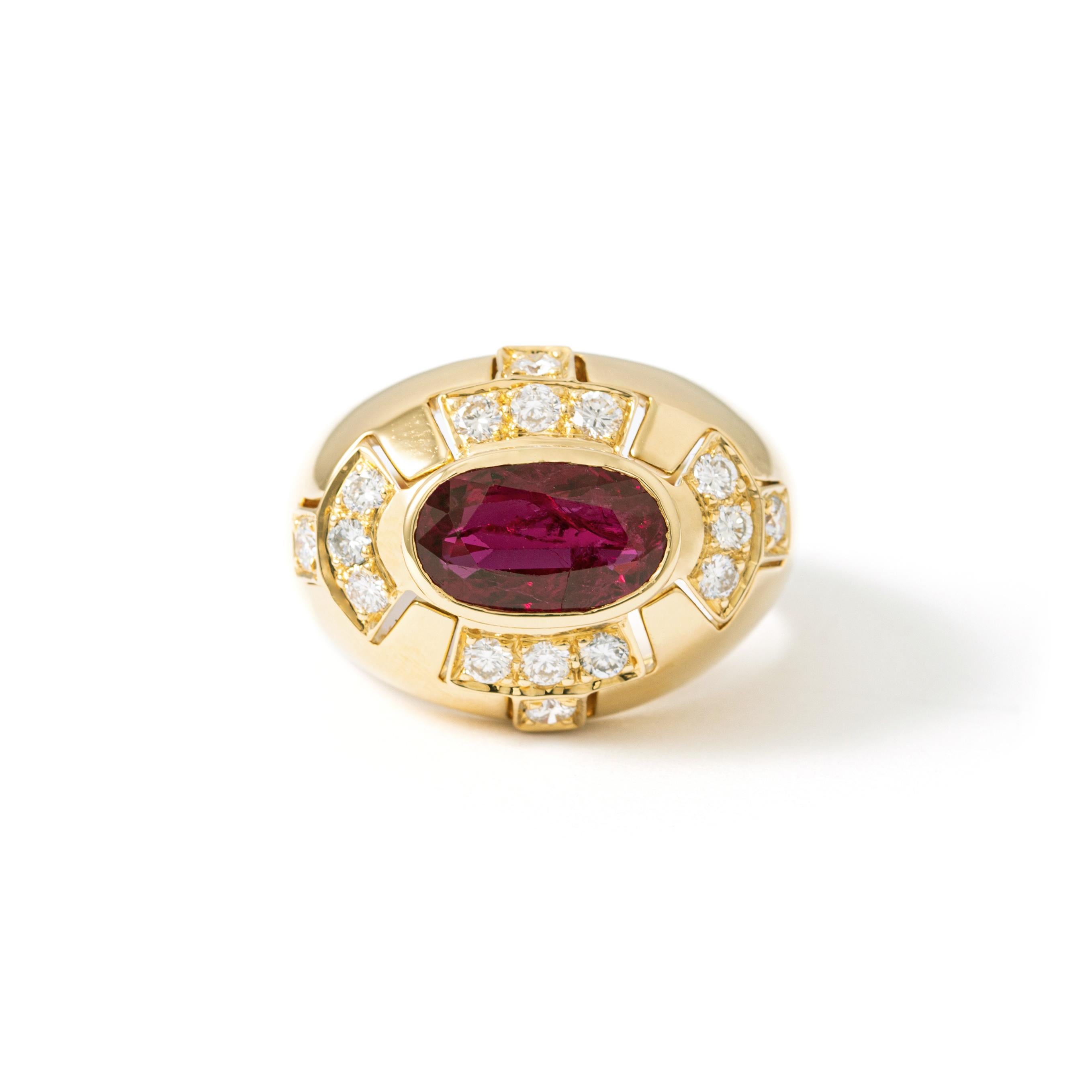Ring in 18kt yellow gold set with one oval cut ruby 3.41 cts and diamonds 1.07 cts Size 53