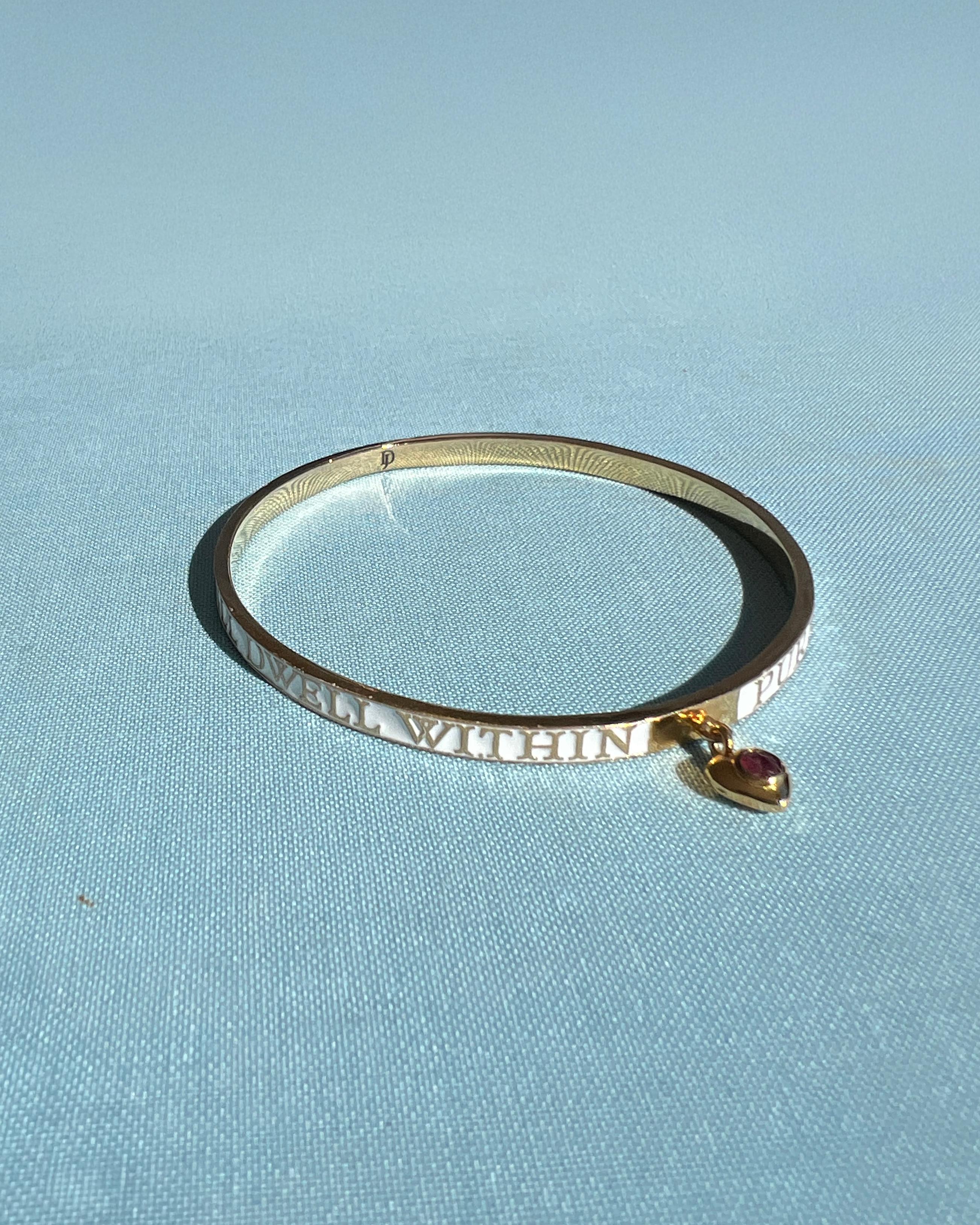 Ruby Heart Bangle Bracelet White Enamel Victorian Style Spiritual Jewelry

Crafted in 14k gold-plated brass and hand-painted with white enamel, this Ruby Heart Bangle by J Dauphin unites Victorian Revival design with Kabbalistic mysticism.

The