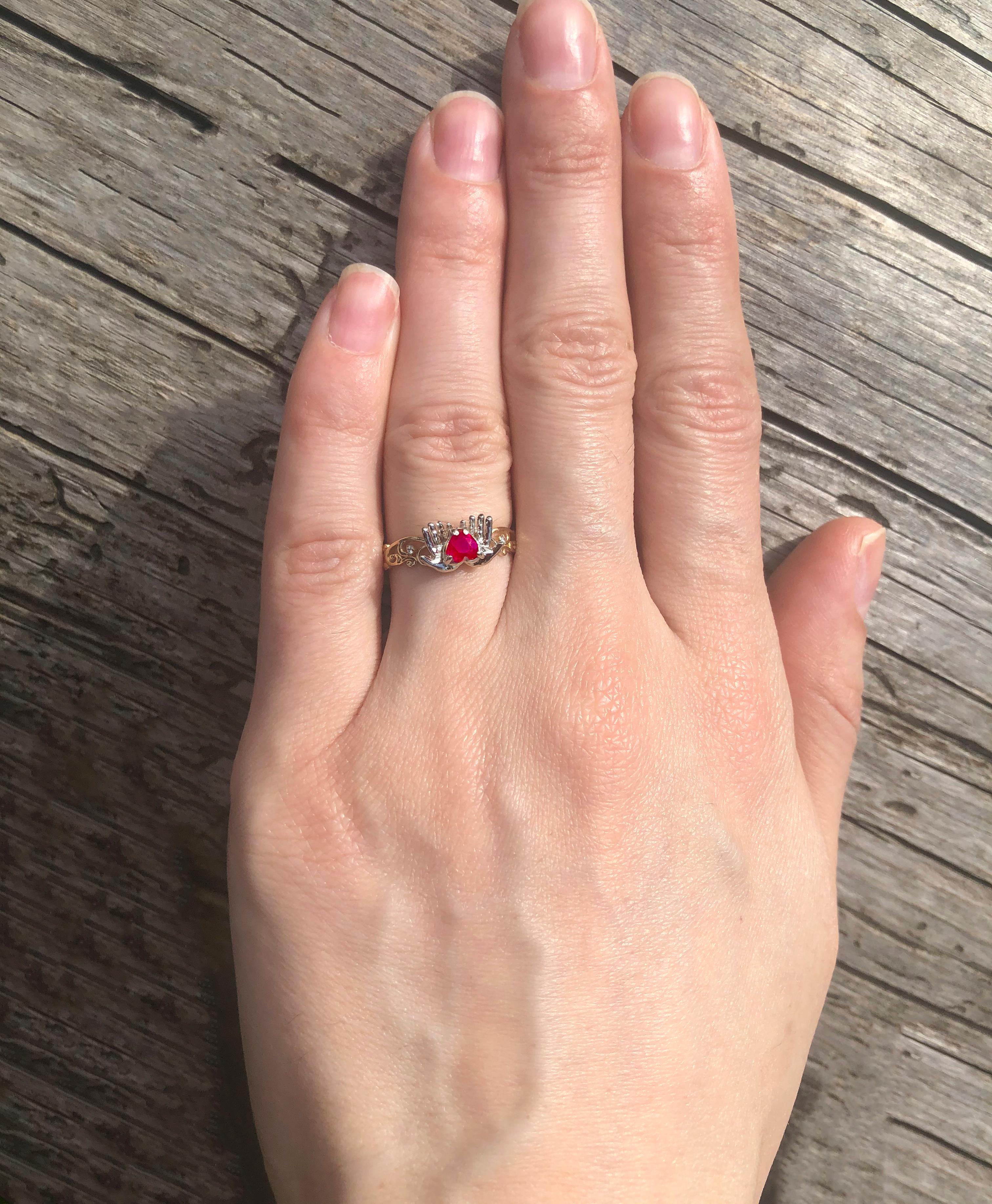 Modern Ruby heart in hands 14k gold ring.  For Sale