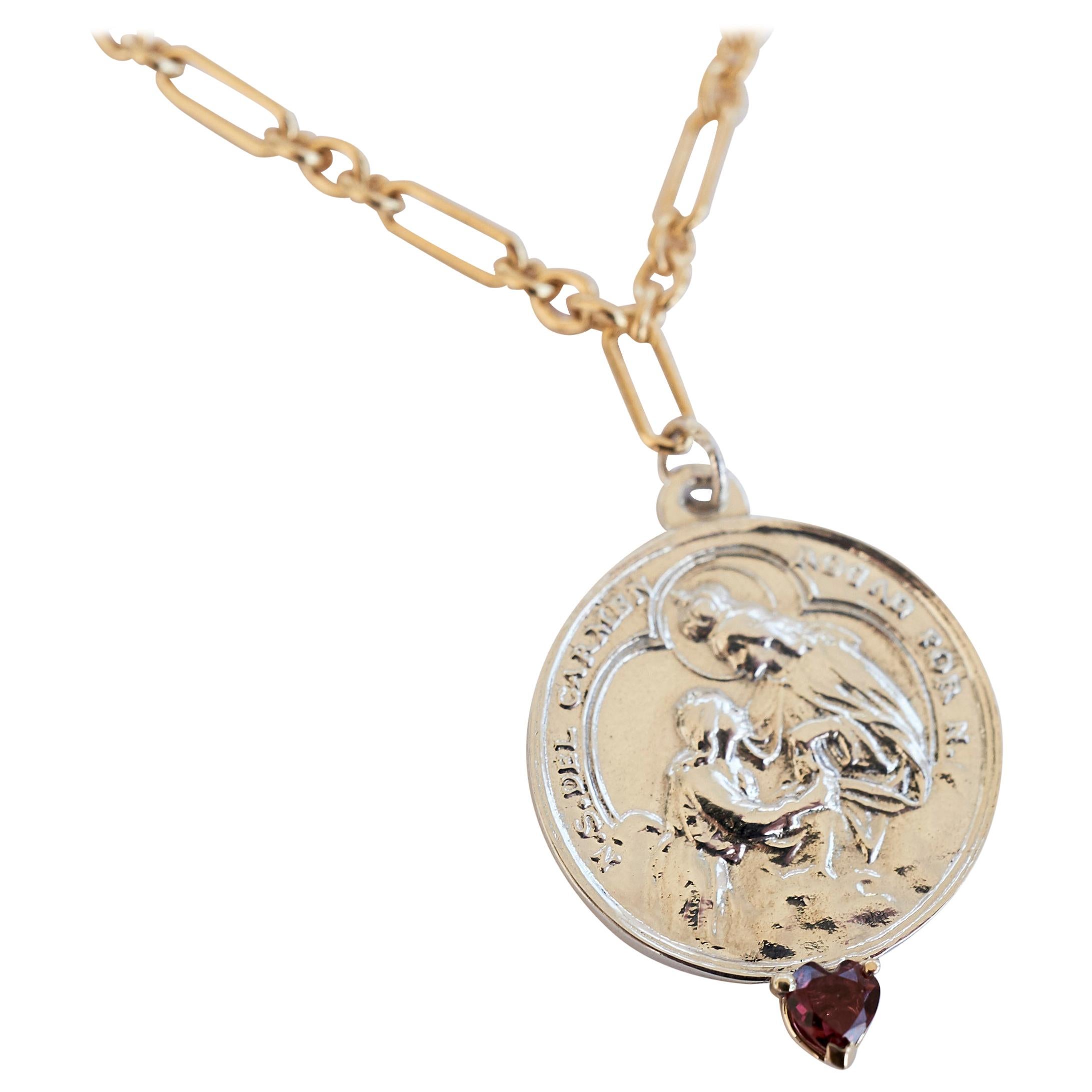 Ruby Heart Virgin del Carmen Medal Coin Silver and Gold Filled Necklace Chain J Dauphin

Exclusive piece with a Round Virgin del Carmen Medal in Silver with a Ruby Heart Cut set in a Gold prong and with a gold filled Chain. Necklace is 24