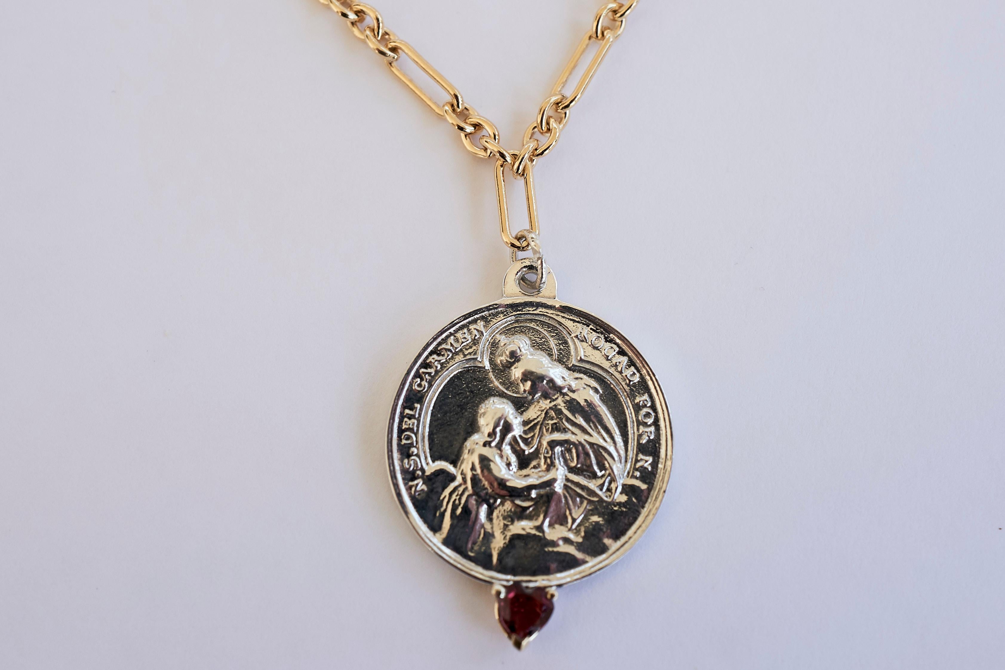 Ruby Heart Virgin Mary Medal Coin Silver and Gold Filled Necklace Chain J Dauphin

Exclusive piece with a Round Virgin Mary Medal in Silver with a Ruby Heart Cut set in a Gold prong and with a gold filled Chain. Necklace is 24