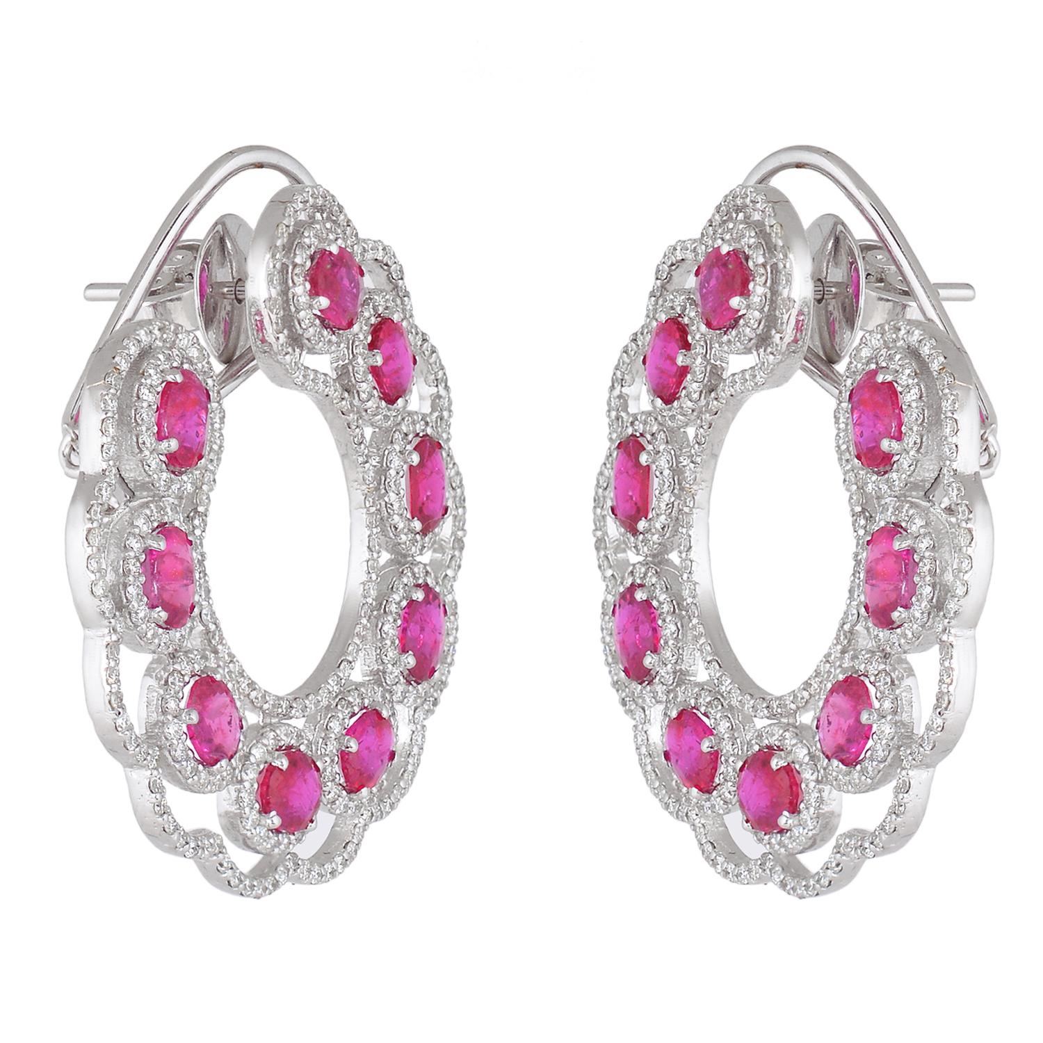 These earrings are made with 18k white gold and round diamonds. The earrings are designed with a hoop style. The diamonds are set in a prong setting. The earrings have a total diamond weight of 1/2 ct.

Specifications

Dimensions: Length: 3.6 cm,