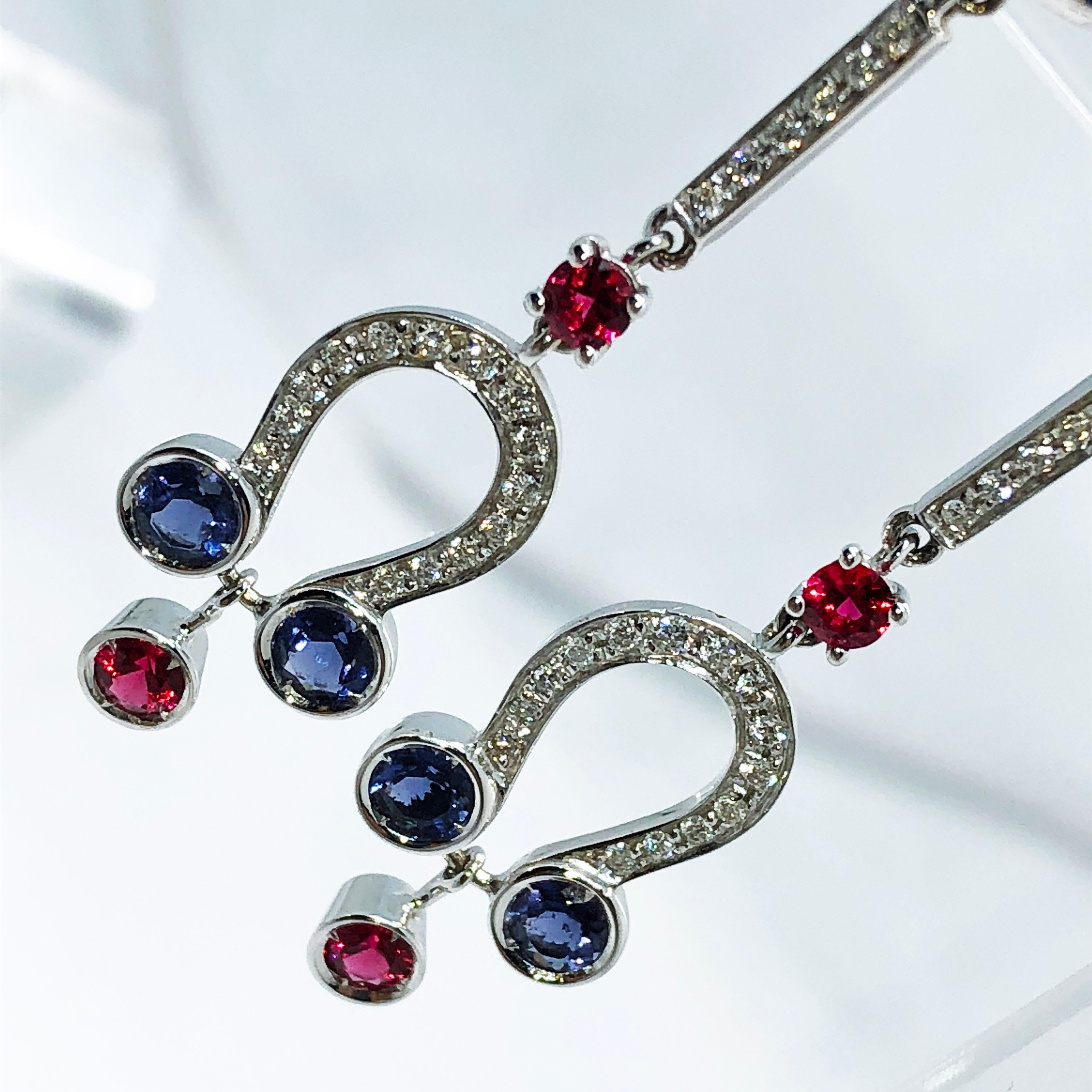 Simple and Chic Art Déco Style Earrings, Blue hand enameled with the antique champslevé technique featuring six Round Rubies(0.73kt), four Iolites (0.46kt), White Diamond(0.35kt) in a 18kt White Gold Setting.
In our fitted tobaco leather case.

