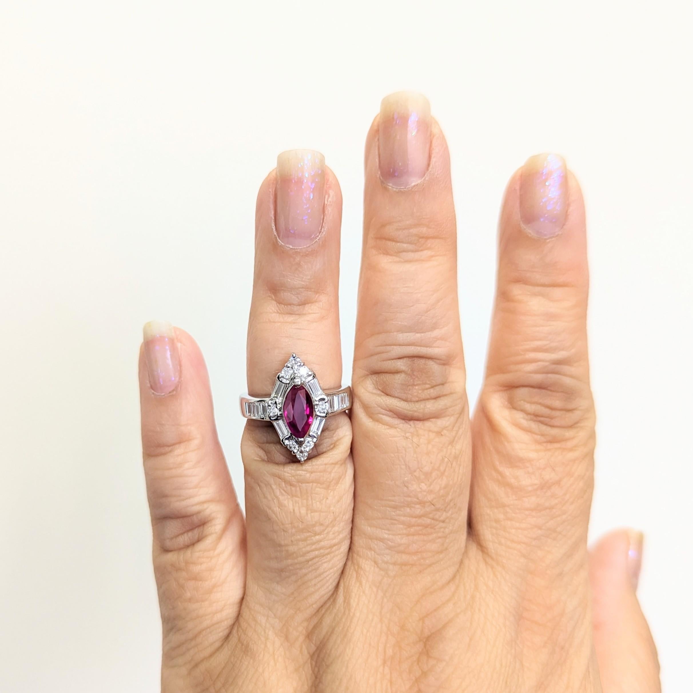 Beautiful 1.02 ct. ruby marquise with 0.78 ct. good quality white diamond rounds and baguettes.  Handmade in platinum.  Ring size 6.25.