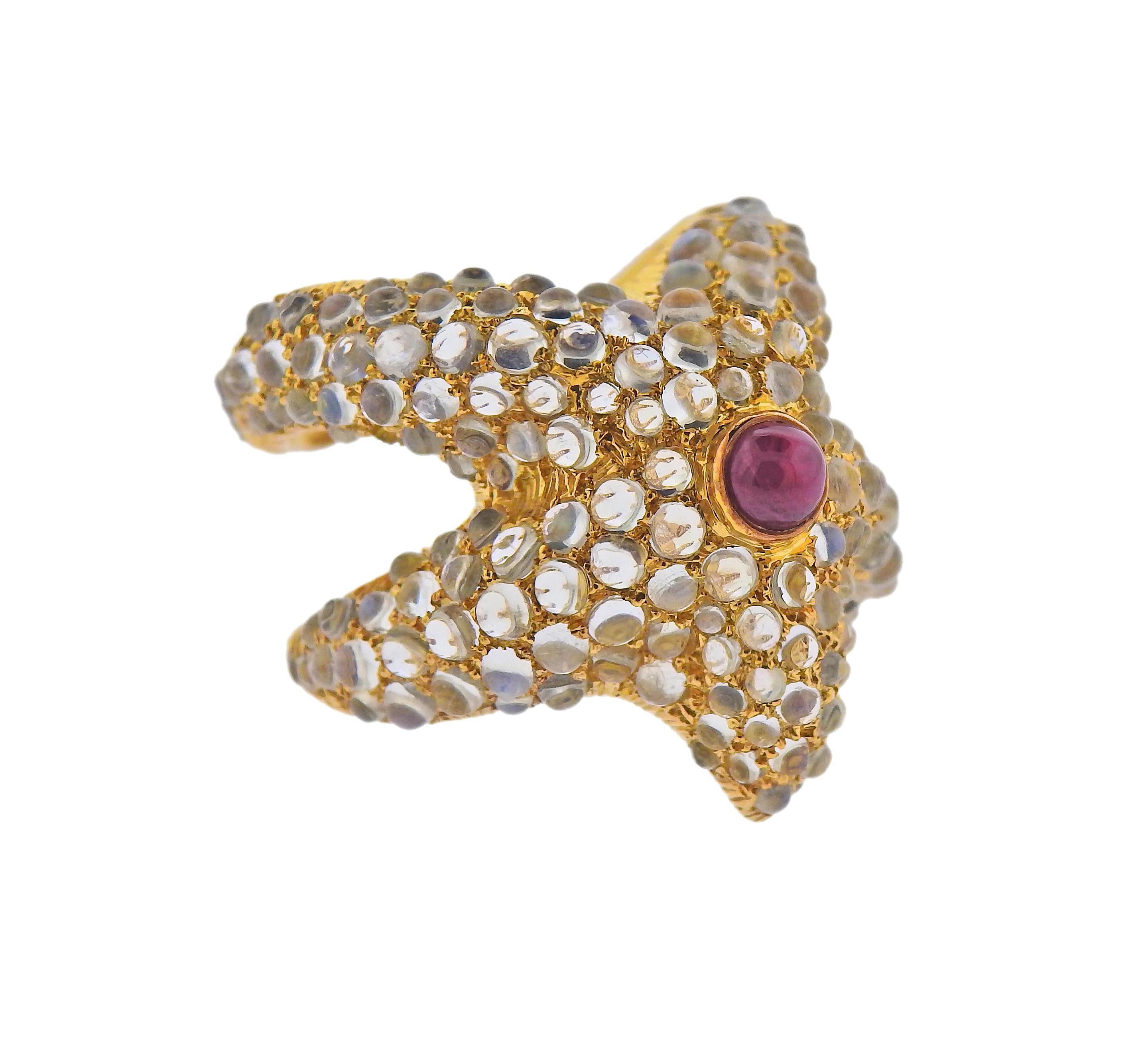 18k gold starfish cuff ring with ruby and moonstone cabochons. Ring size - 6.25, ring top is 24mm wide. Weight - 6.7 grams. 