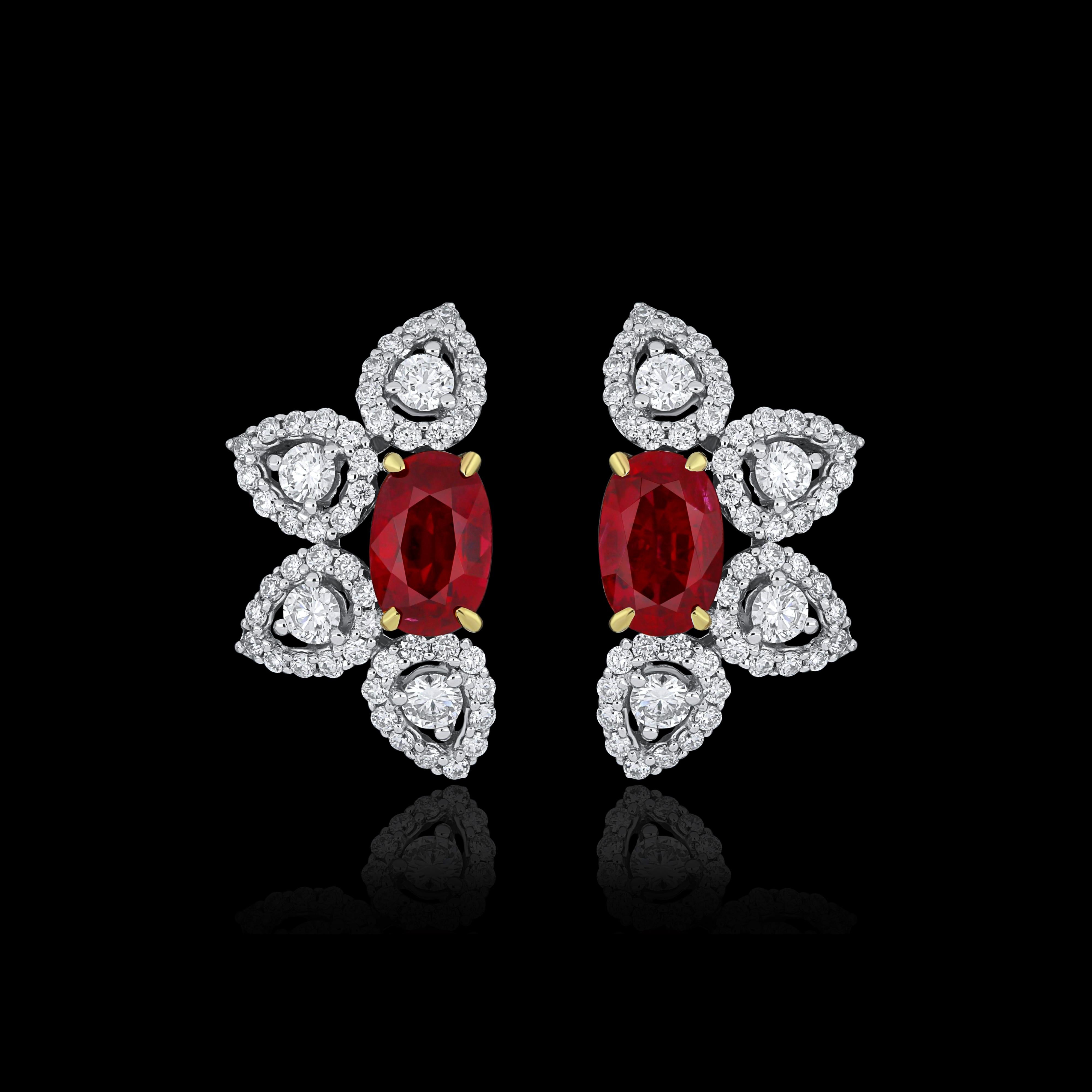 Elegant and exquisitely detailed 18 Karat White Gold Earring, center set with 1.12 Cts .Oval Shape Ruby Mozambique and micro pave set Diamonds, weighing approx. 0.62 Cts Beautifully Hand crafted in 18 Karat White Gold.

Stone Detail:
Ruby