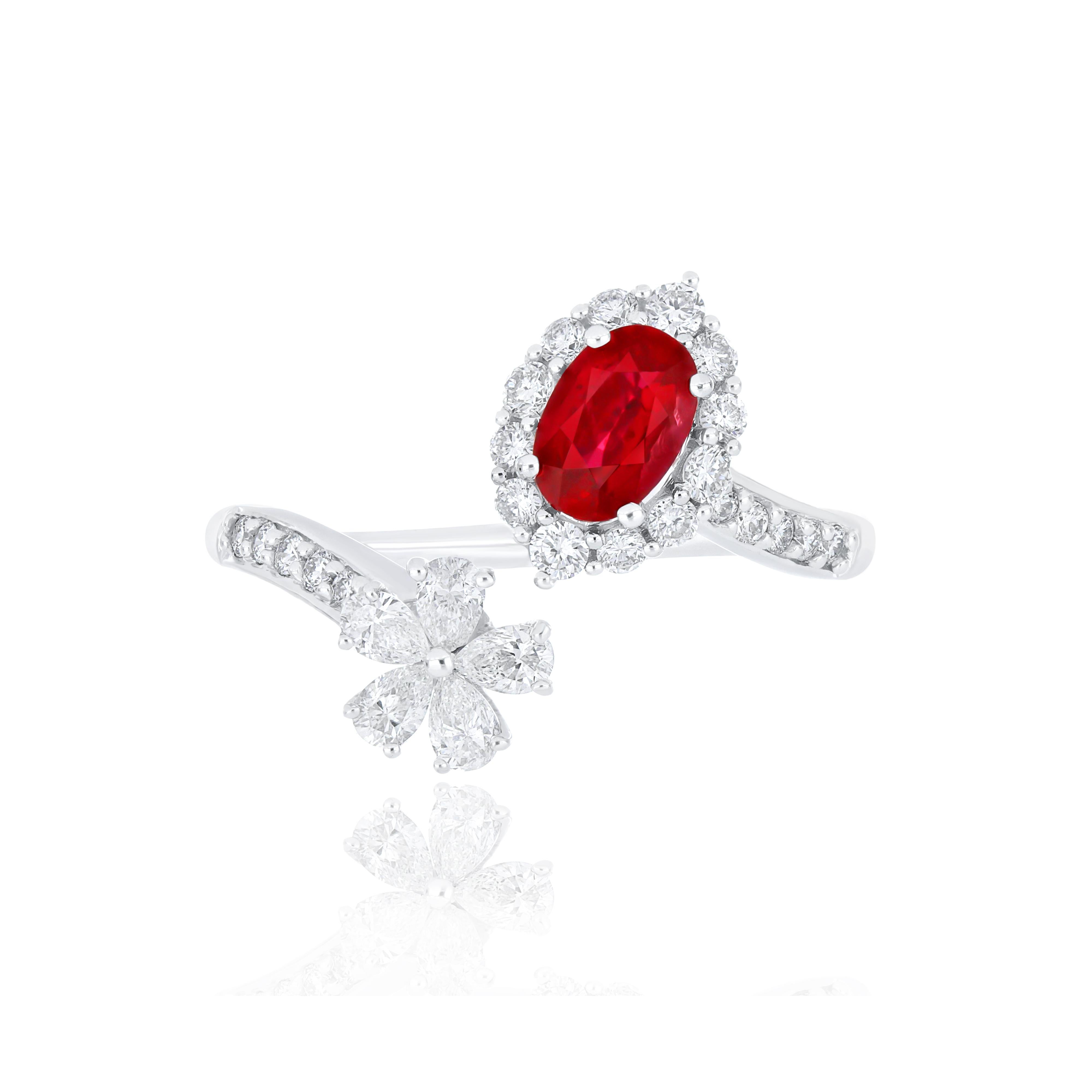 Elegant and exquisitely detailed 18 Karat White Gold Ring, center set with 0.56 Cts .Oval Shape Ruby Mozambique and micro pave set Diamonds, weighing approx. 0.59 Cts Beautifully Hand crafted in 18 Karat White Gold.

Stone Detail:
Ruby Mozambique: