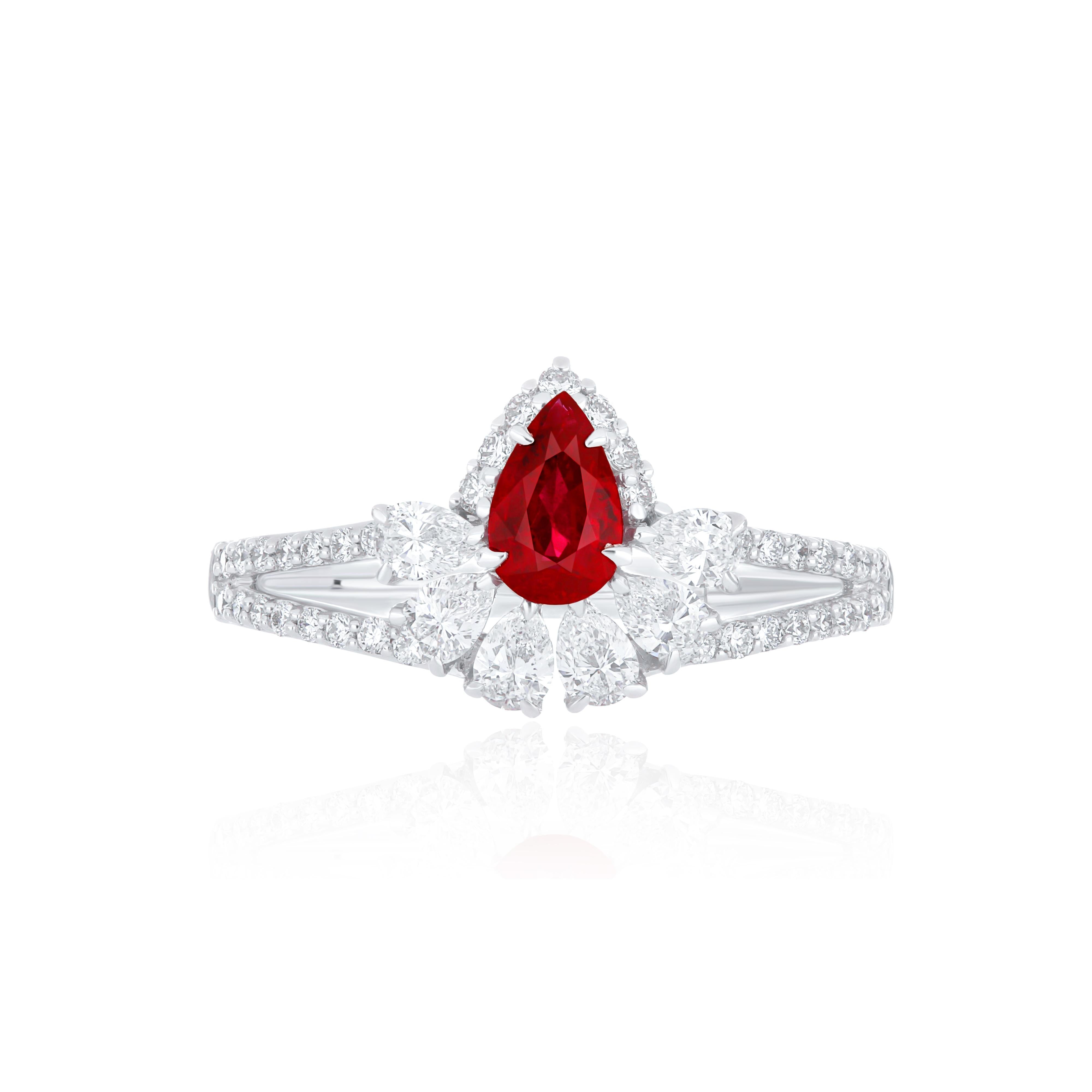 Elegant and exquisitely detailed 18 Karat White Gold Ring, center set with 0.40 CT's. Pear Shape Ruby Mozambique and micro pave set Diamonds, weighing approx. 0.63 CT's Beautifully Hand crafted in 18 Karat White Gold.

Stone Detail:
Ruby Mozambique: