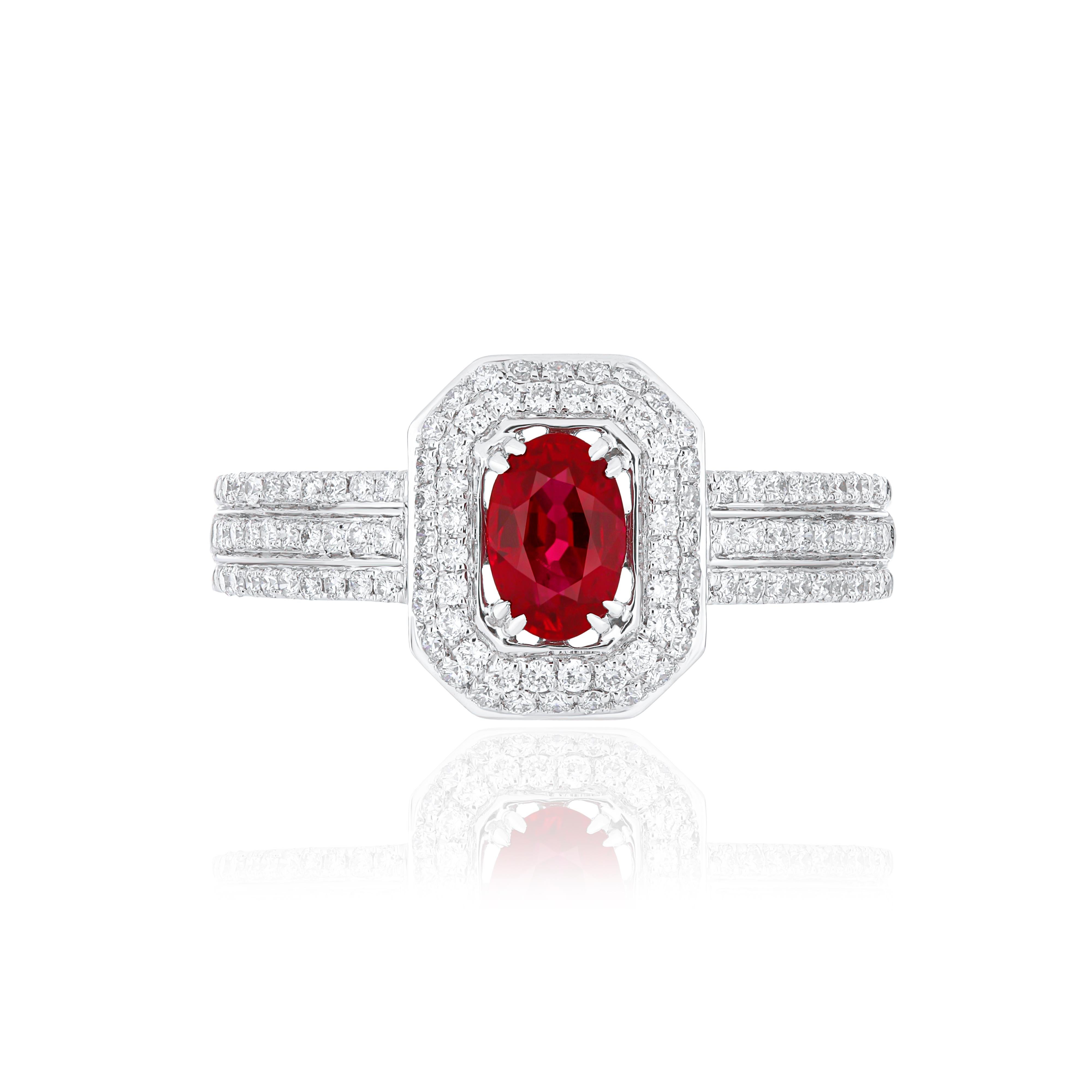 Elegant and exquisitely detailed 18 Karat White Gold Ring, center set with 0.55 CT's .Oval Shape Ruby Mozambique and micro pave set Diamonds, weighing approx. 0.39 CT's Beautifully Hand crafted in 18 Karat White Gold.

Stone Detail:
Ruby Mozambique: