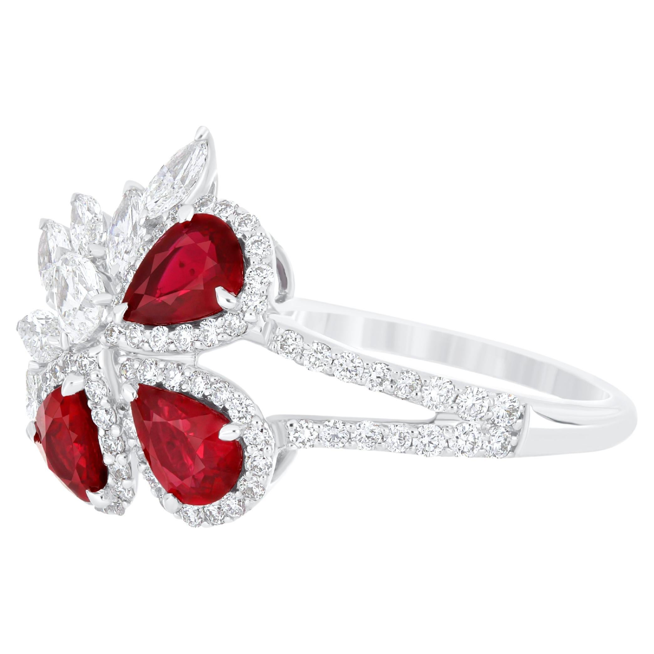 Elegant and exquisitely detailed 18 Karat White Gold Ring, center set with 0.91 Cts .Pear Shape Ruby Mozambique and micro pave set Diamonds, weighing approx. 0.80 Cts Beautifully Hand crafted in 18 Karat White Gold.

Stone Detail:
Ruby Mozambique: