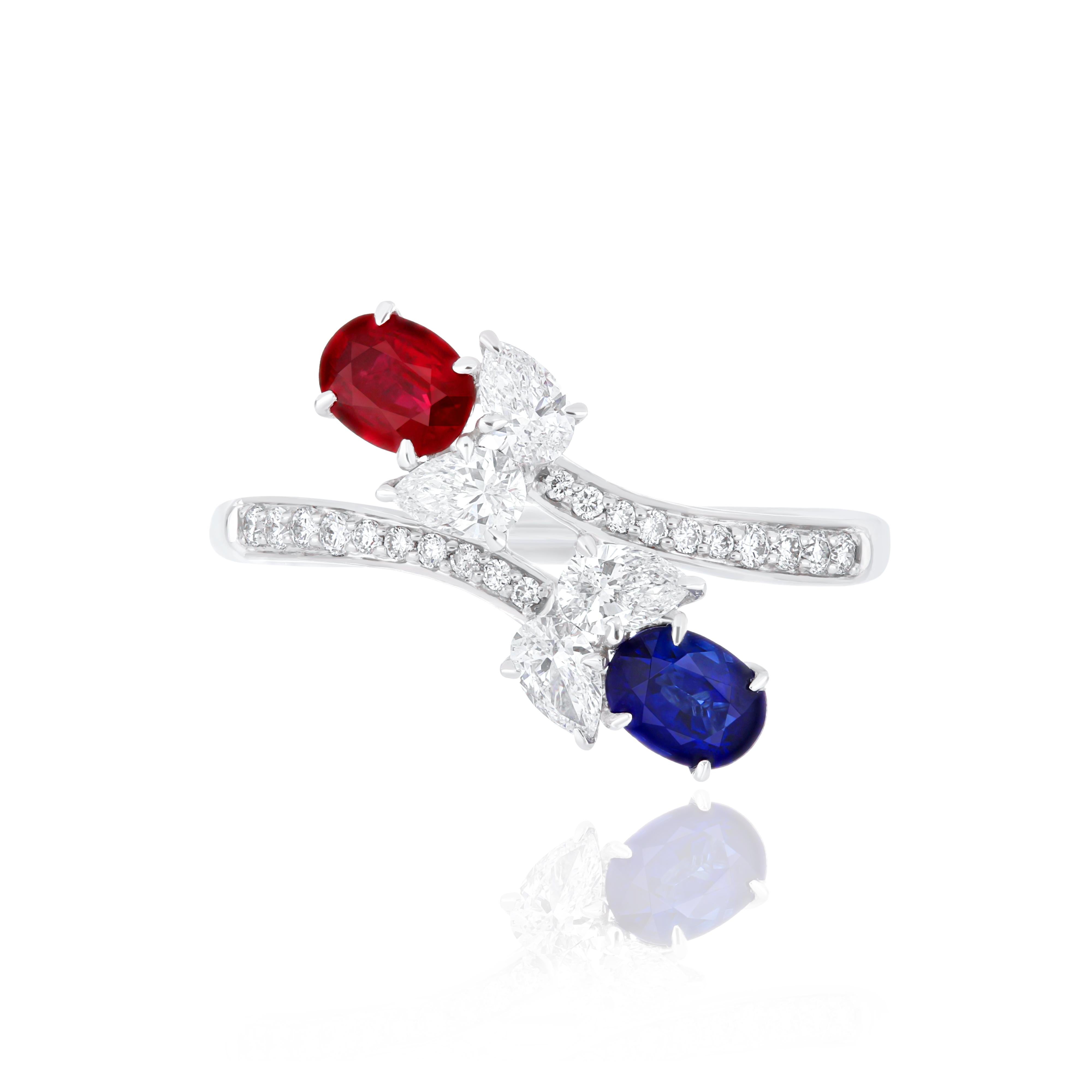 Elegant and exquisitely detailed 18 Karat White Gold Ring, center set with 0.34Cts .Oval Shape Ruby Mozambique, Blue Sapphire With 0.51Cts and micro pave set Diamonds, weighting approx. 0.57Cts Beautifully Hand crafted in 18 Karat White Gold.

Stone