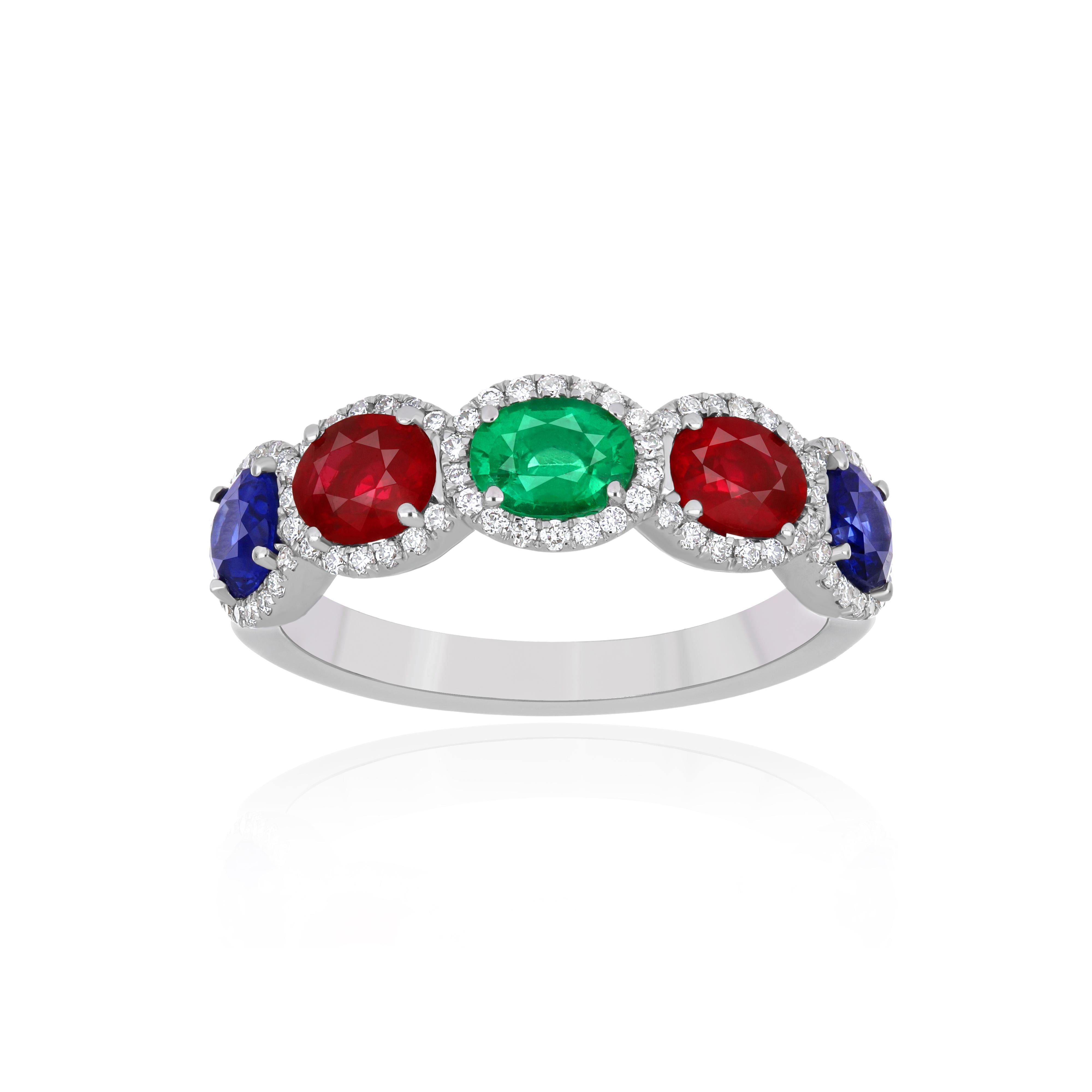 Elegant and exquisitely detailed 18 Karat White Gold Ring, center set with 0.98Cts .Oval Shape Ruby Mozambique, Blue Sapphire with 0.95Cts, Emerald With 0.27Cts and micro pave set Diamonds, weighing approx. 0.26Cts Beautifully Hand crafted in 18
