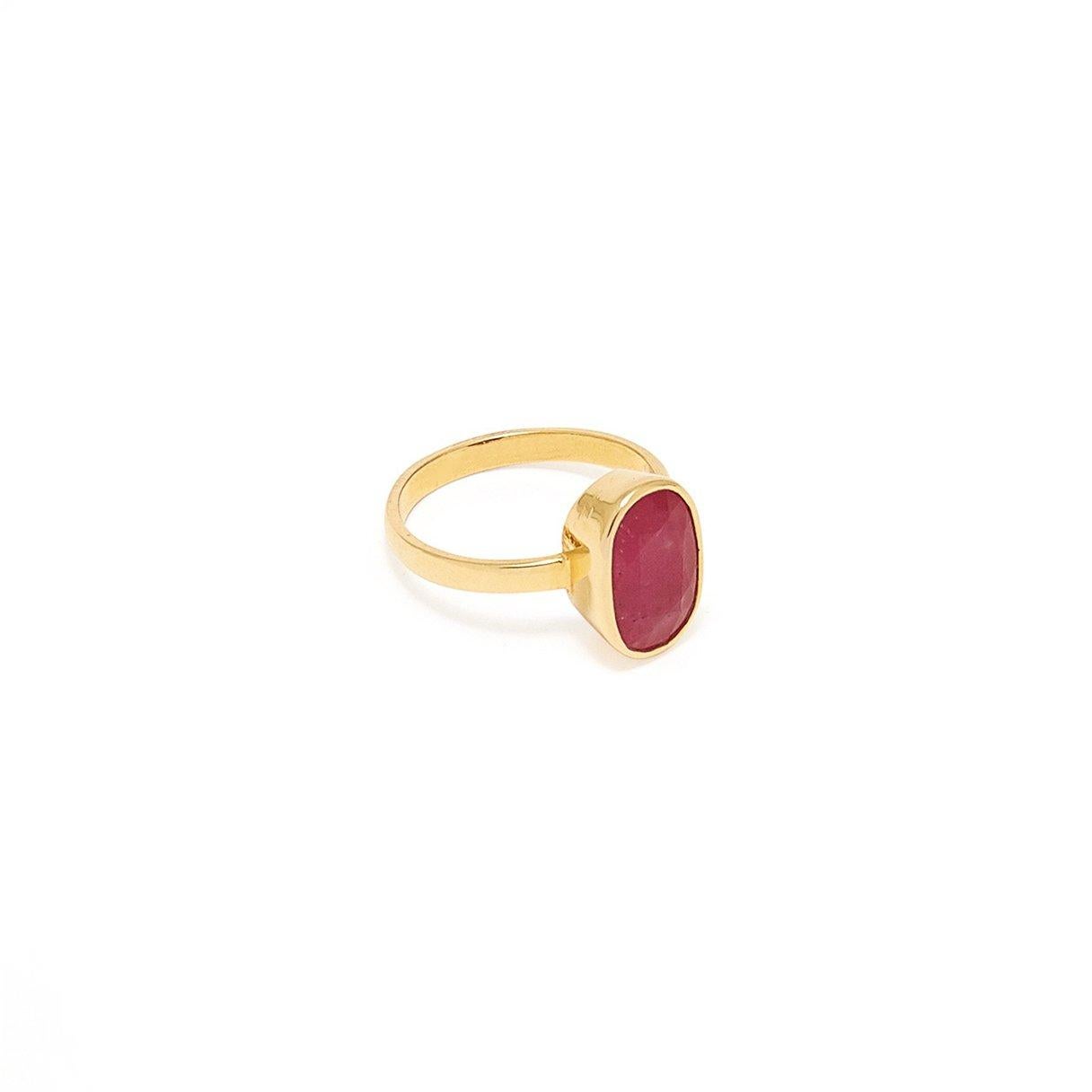 The Ruby, which corresponds to the Sun in Vedic Astrology, is interpreted here with a beautiful pinkish red Ruby in a band crafted of 18 karat gold.

- Natural Ruby weight approx 4.75 Carats.    
- Set in 18 Karat Gold.

According to Vedic