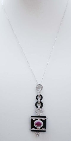 Ruby, Onyx, Diamonds, Platinum and White Gold Pendant Necklace.