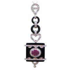 Ruby, Onyx, Diamonds, Platinum and White Gold Pendant Necklace.