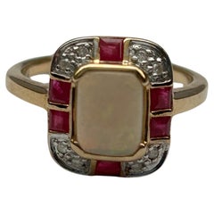 Ruby, Opal (est 0.8ct) & Diamond (est 0.6ct) Yellow Gold Cluster Ring