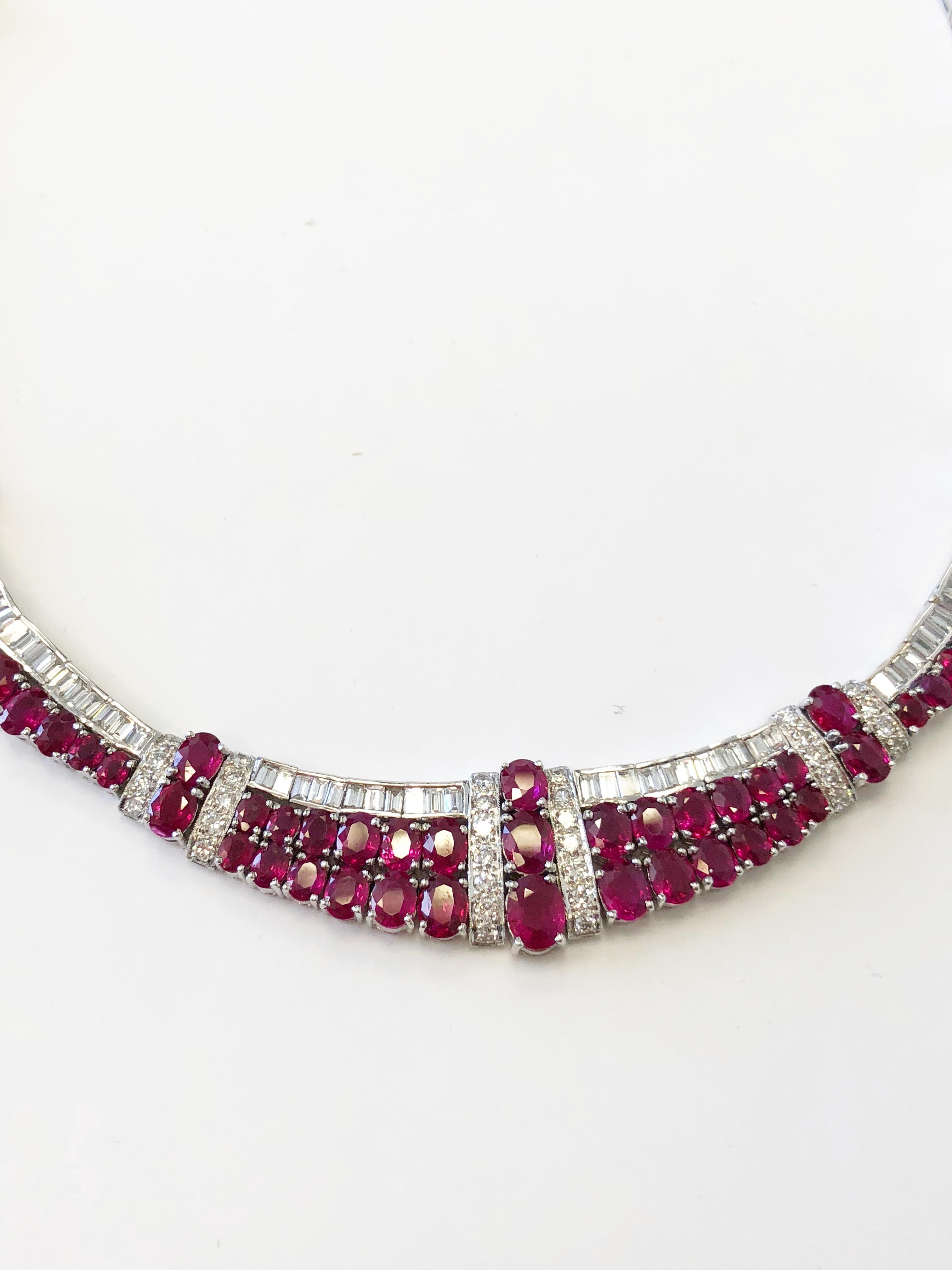 Beautiful deep red ruby ovals weighing 50 carats with 15 carats of bright white baguette and round diamonds in a handmade 18k white gold mounting.  Necklace is made nicely with no chunky gold and good flexibility.  Stones are bright and the design