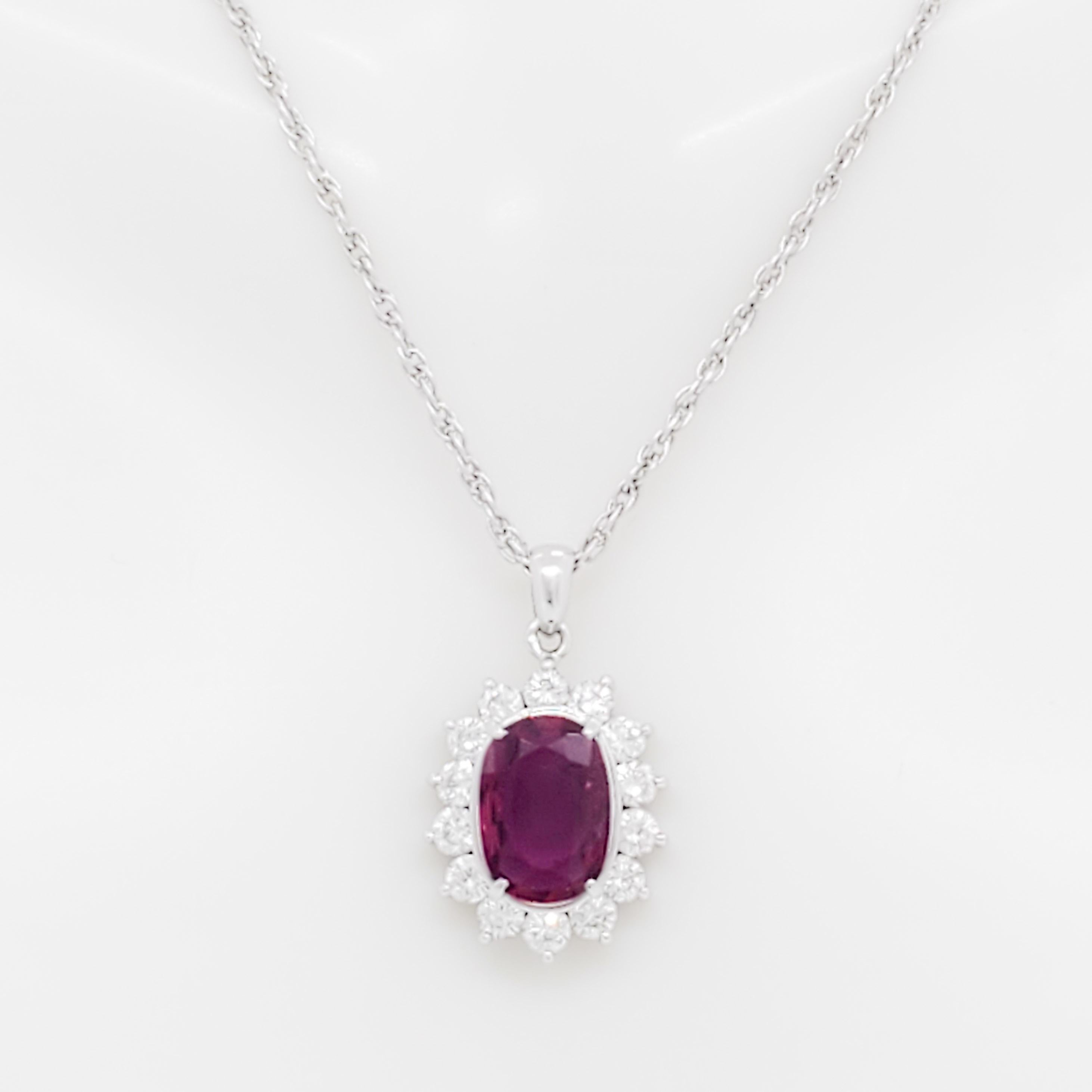 Gorgeous 2.04 ct. ruby oval with 0.82 ct. good quality white diamond rounds.  Handmade in platinum.  Length of chain is 16