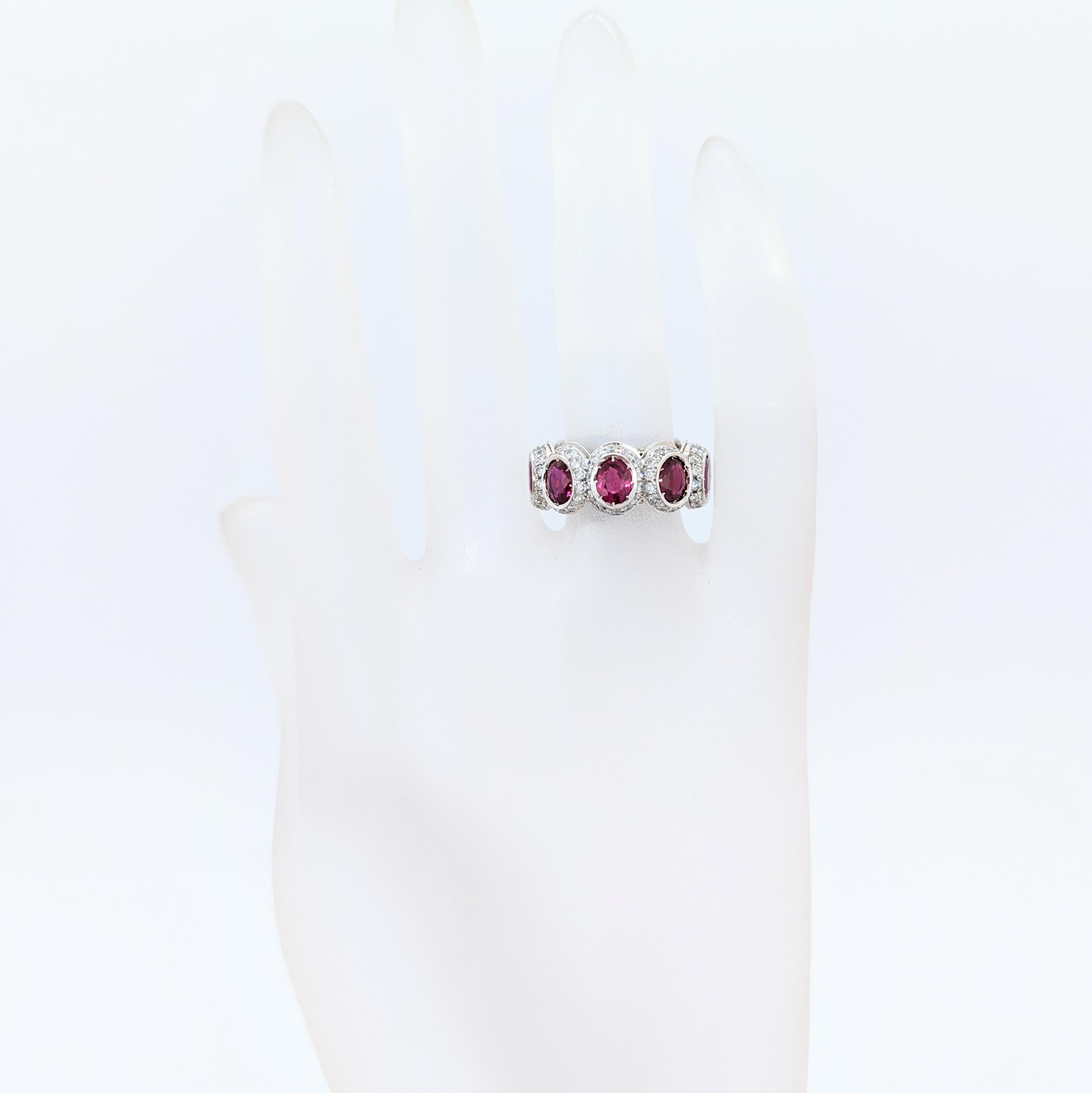 Beautiful 5.50 ct. ruby oval with 1.85 ct. good quality white diamond rounds.  Handmade in 18k white gold.  Ring size 5.75.