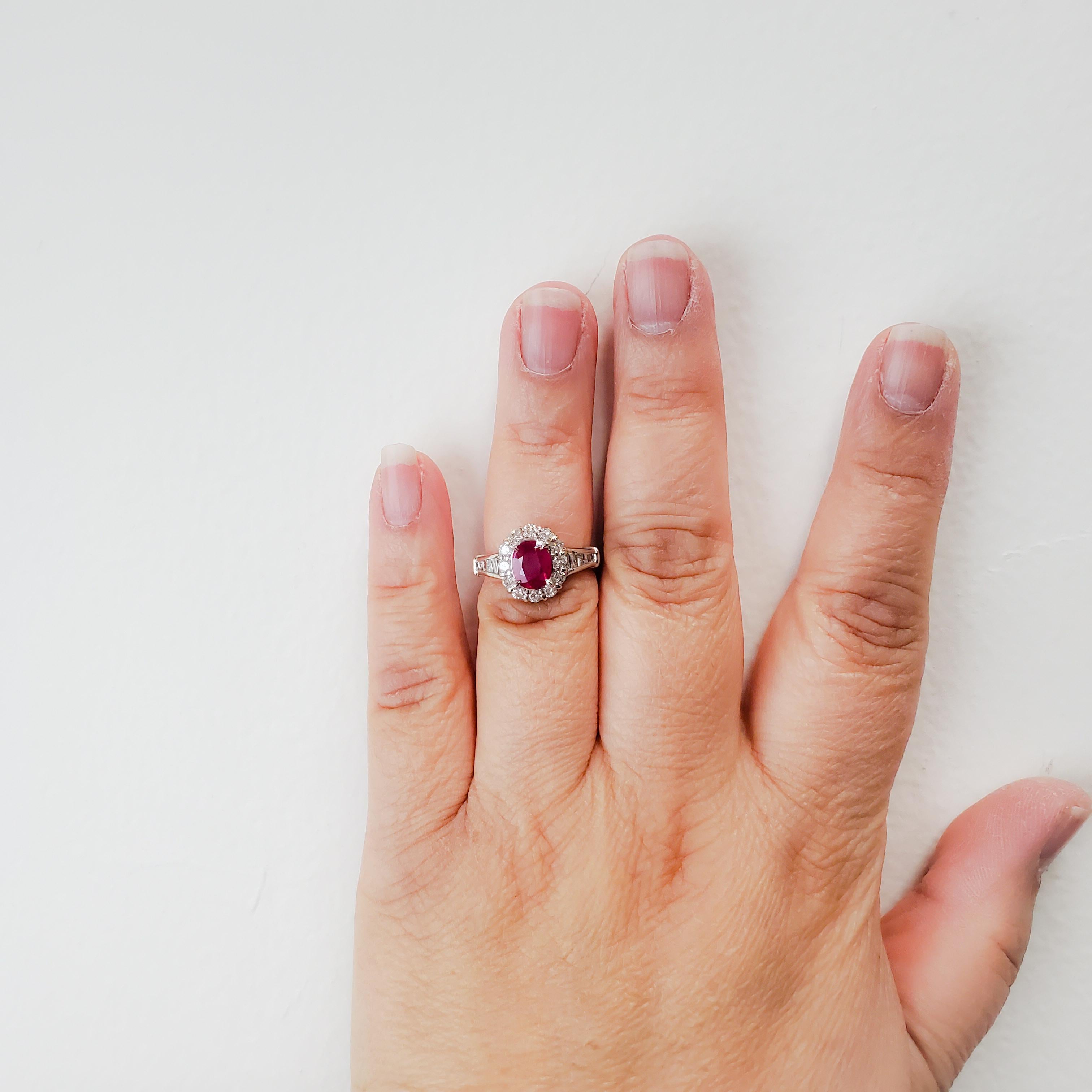 Gorgeous 1.48 ct. ruby oval with 0.77 ct. good quality white diamond rounds and baguettes.  Handmade platinum mounting in ring size 5.75.  