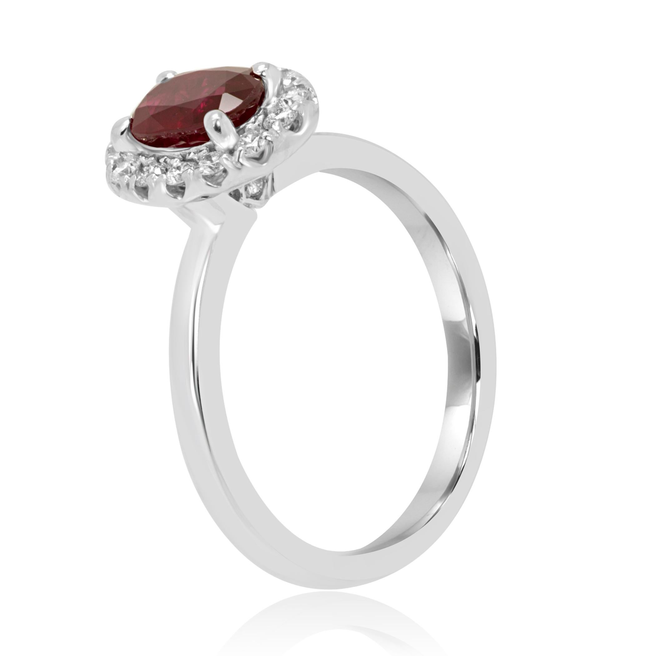 Stunning Ruby Oval 0.93 Carat Encircled in a single Halo of White G-H Color VS-SI Round Diamonds 0.25 Carat in Classic 14K White Gold Bridal Fashion Cocktail Ring. Total Weight 1.18 Carat.

Style available in different price ranges. Prices are based