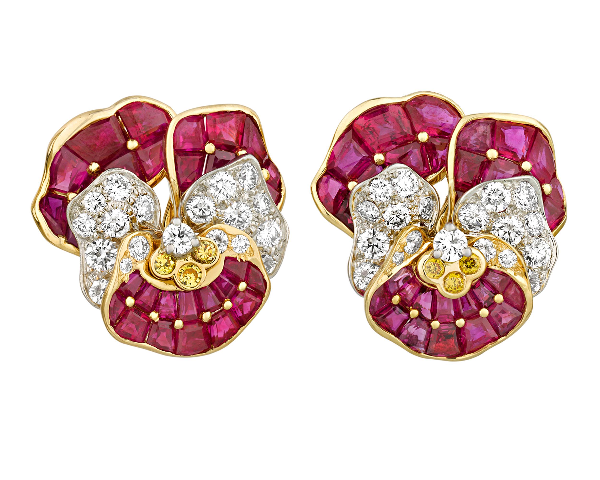 These diamond and ruby floral earrings were created by the renowned American jewelry firm Oscar Heyman. Taking the shape of a pansy, the earrings feature a remarkable 13.32 total carats of rubies complemented by white and fancy yellow diamond