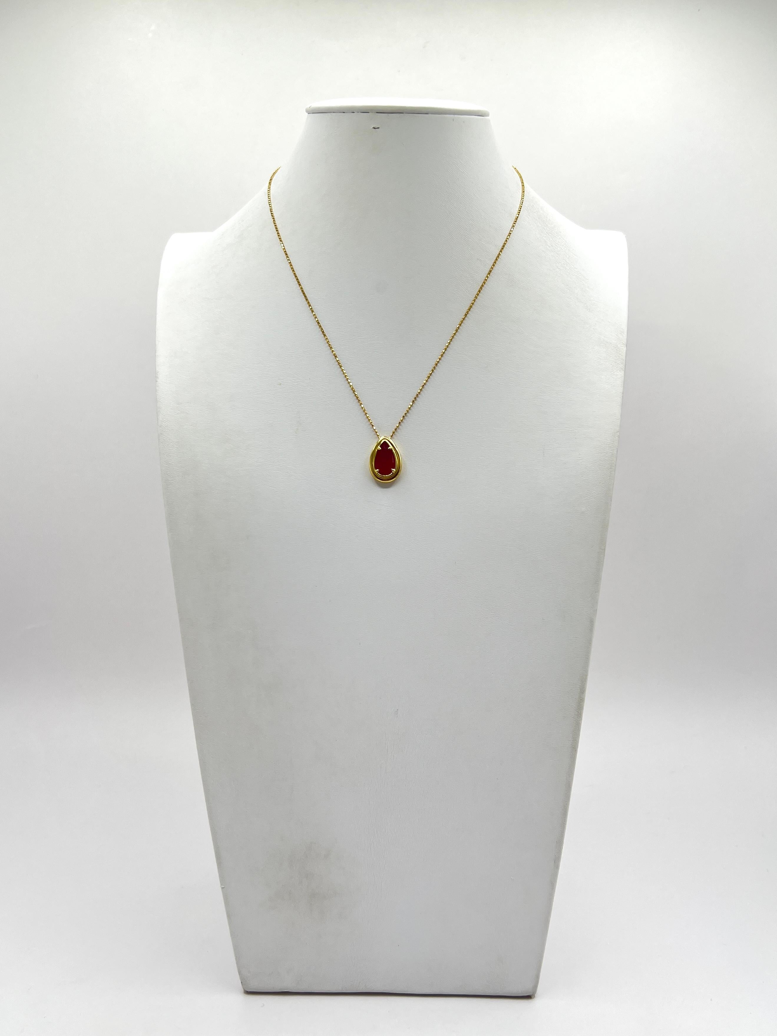 Beautiful 2.67 ct. bright red ruby pear shape.  Handmade in 18k yellow gold.  Length is 16