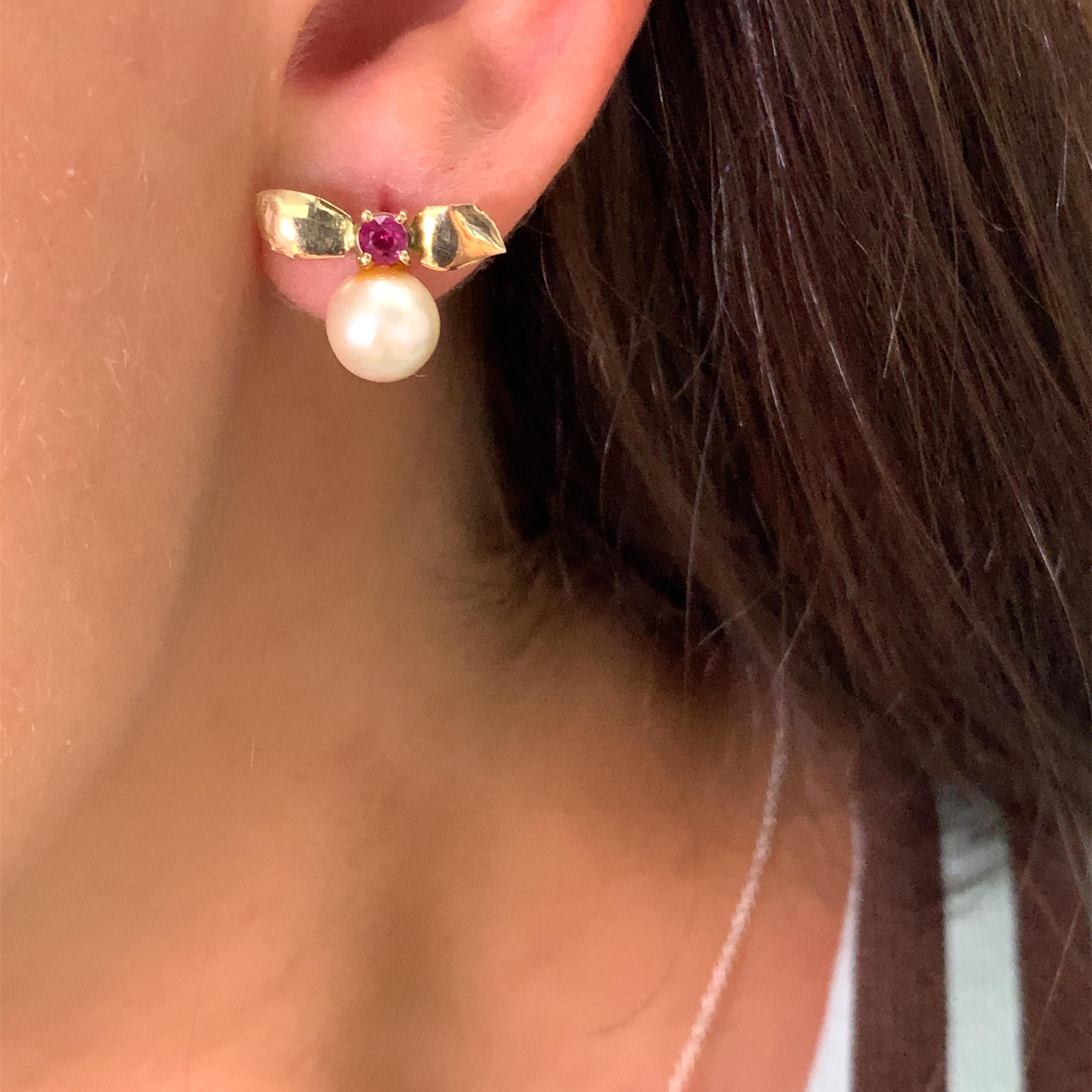 Add a touch of elegance to your outfit with these stunning 0.35ct Ruby pearl studs earrings. Crafted from 18ct yellow gold, these earrings feature a round, cultured Ruby as the main stone with a total carat weight of 0.35. The earrings also boast a