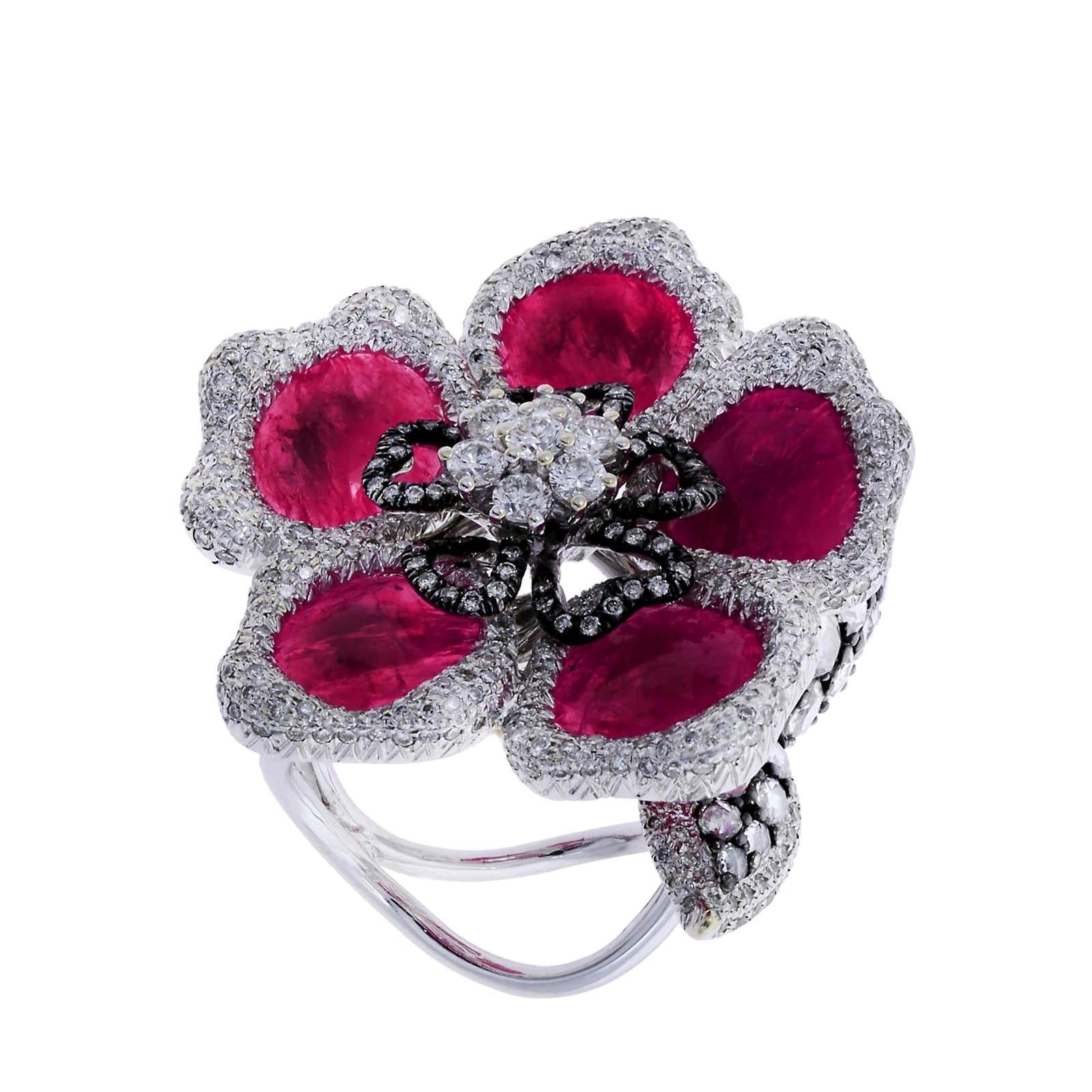 A powerful floral design with Rubies as petals, accented with diamonds all around. Diamonds: 4.10 cts, Ruby 13.44 cts. Measurements: 1.5