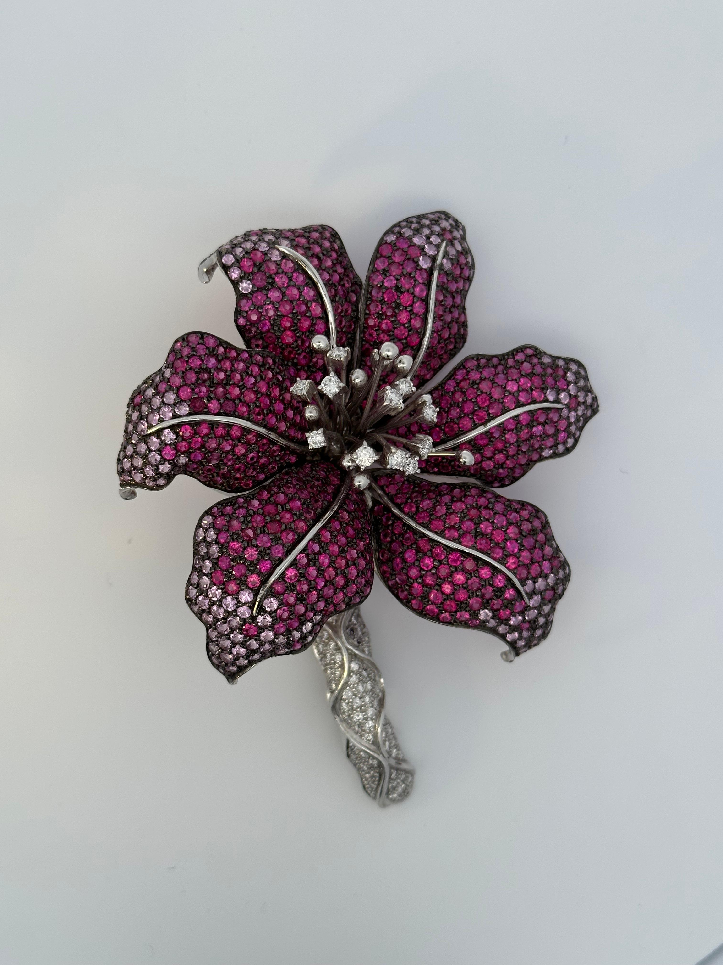 Large Orchid Brooch set with Rubies, Pink Sapphires and diamonds in 18kt white gold with a black rhodium finish that brings out the depth of the colours and magnificent 