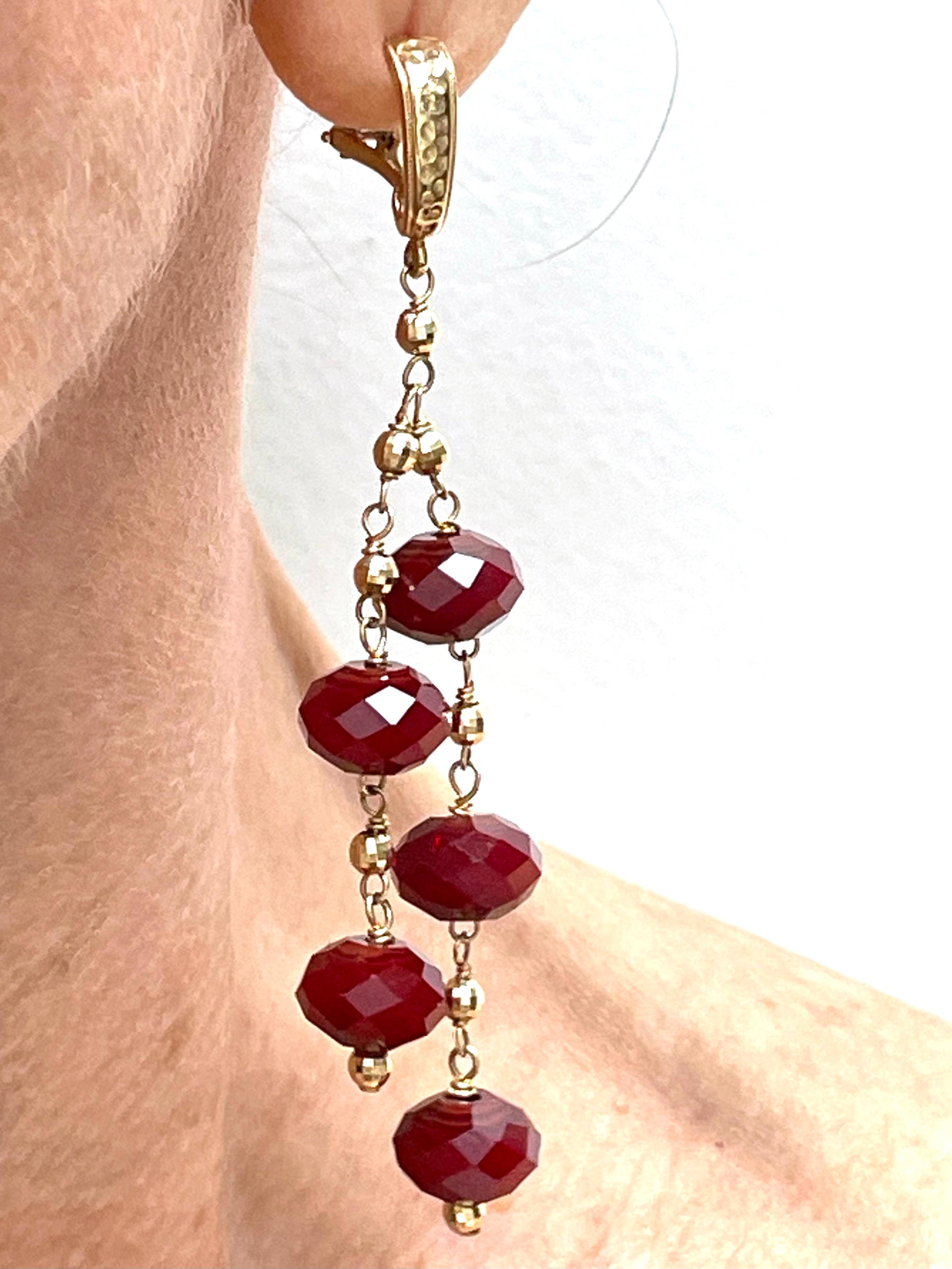 Description
Whimsical, festive, cheerful. Isn’t that what the season calls for? Prominent, lightweight, full of bold sparkling rich red Ruby Quartz mingling with tiny faceted yellow gold balls suspended from hand hammered posts with omega backs.