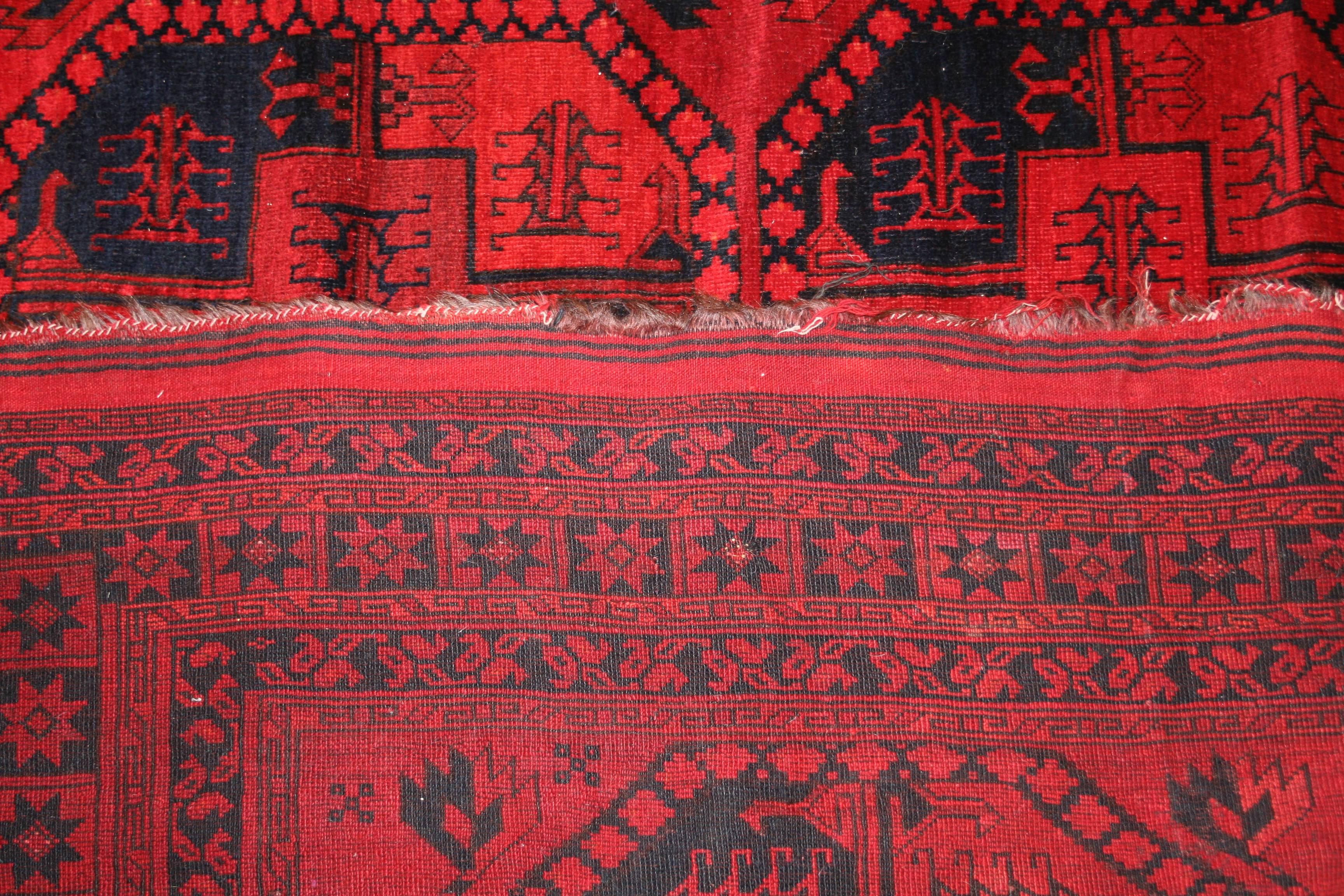 Hand-Knotted Ruby Red Ersari Turkmen Rug with All-Over Geometric Pattern, 1930s For Sale