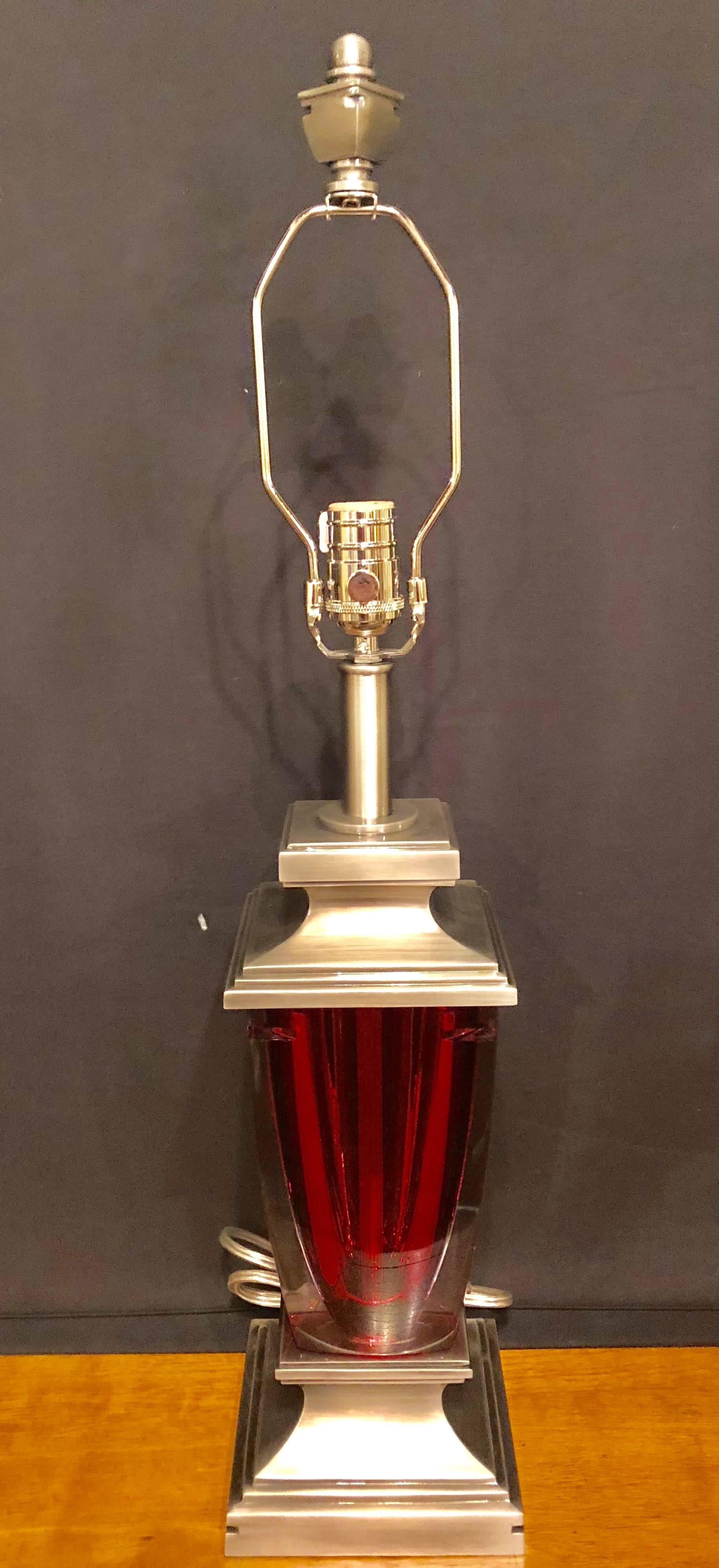 Ruby red glass waterford table lamp. The center red vase signed Waterford mounted with chrome upper and lower supports.