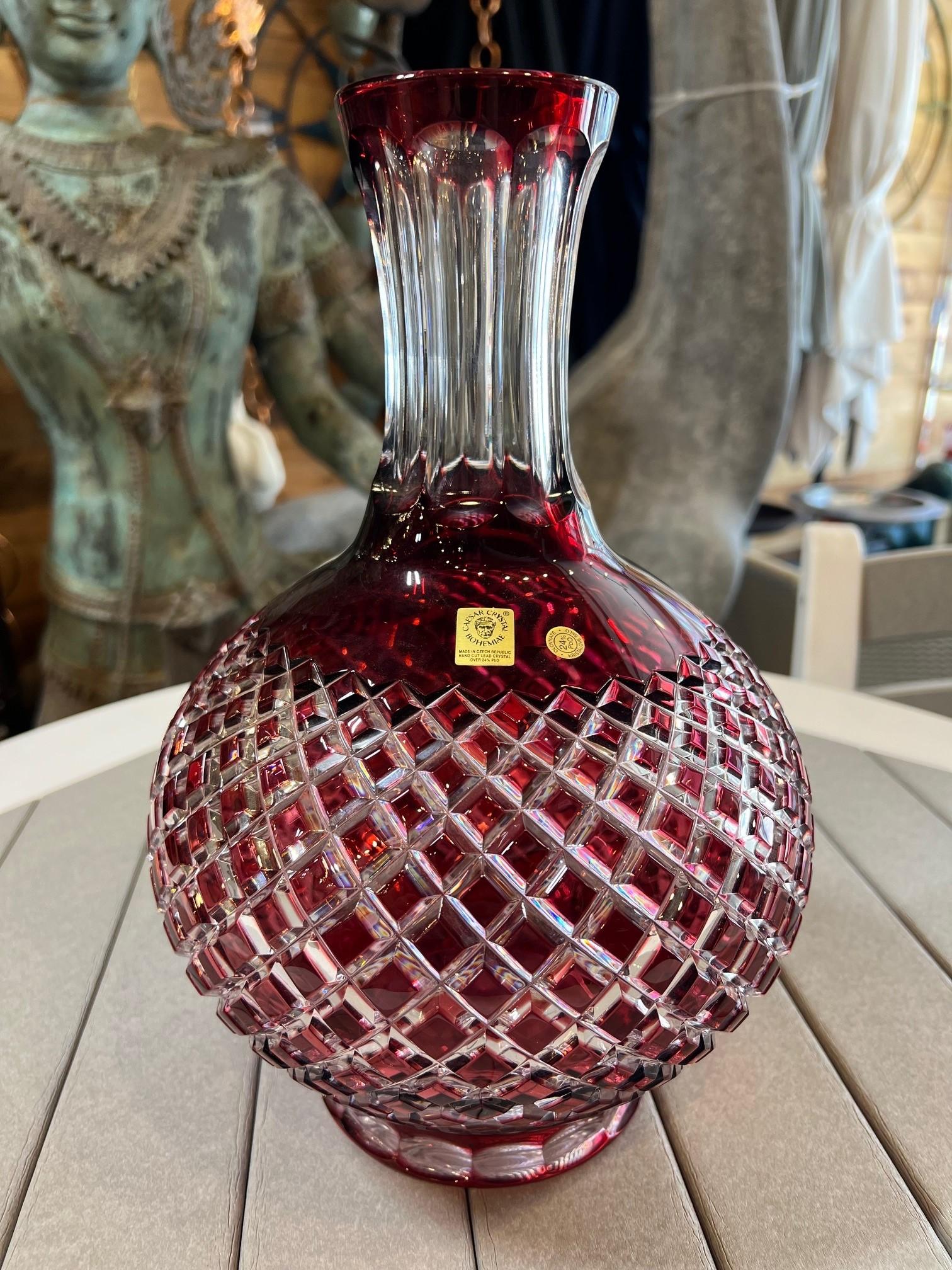 Stunning ruby red hand cut lead crystal vase created as a work of art by the hands of the finest Czech glass workers. The Caesar Crystal Company in the Czech Republic has been selling hand cut lead crystal pieces since 1861 and is known as one of