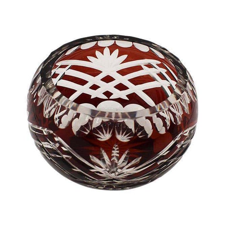 An exceptional cut to clear ruby red crystal votive holder. Perfect for adding soft lighting to a tablescape or side table. Or, you could add a small bouquet of your favorite flowers. 

Dimensions:
2.5