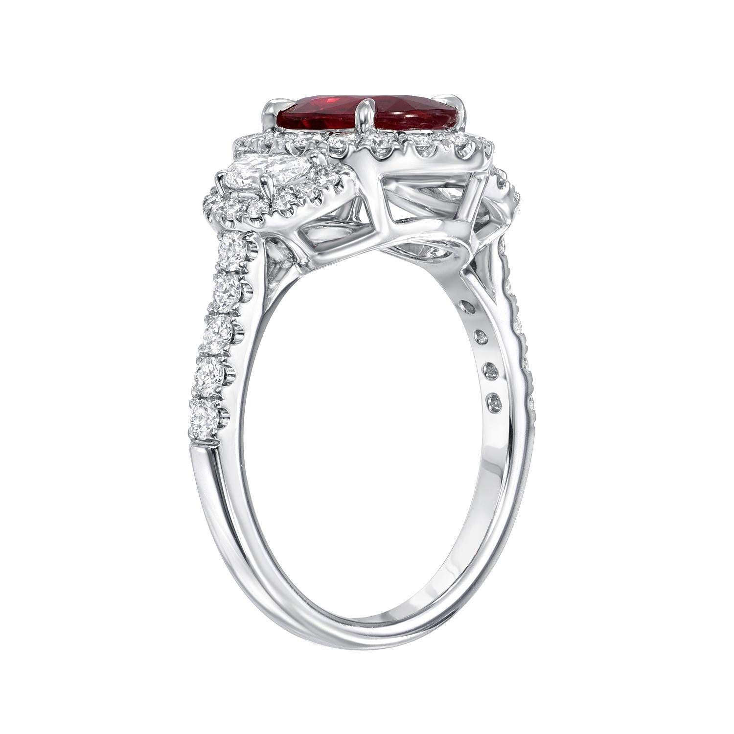 Out of the ordinary 1.52 carat Madagascar vivid red oval Ruby ring, flanked by a pair of half moon diamonds, surrounded by round brilliant diamonds weighing a total of 0.96 carats.
Ring size 6.5. Resizing is complementary upon request.
Crafted by