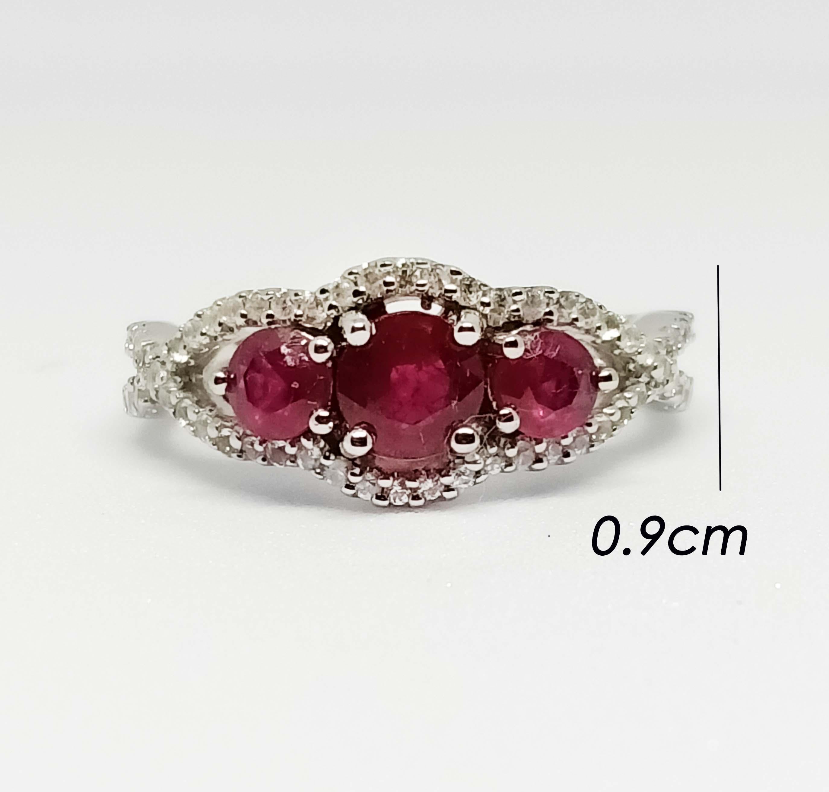 Ruby round 5 mm 1 pc
Ruby roynd 4 mm. 2 pcs total 1.85 cts 
White zircon 1 mm. 52 pcs.
White gold Plated over stering silver.
size 8 us.

Can be smaller resizable free. take up 7 days before ship.
