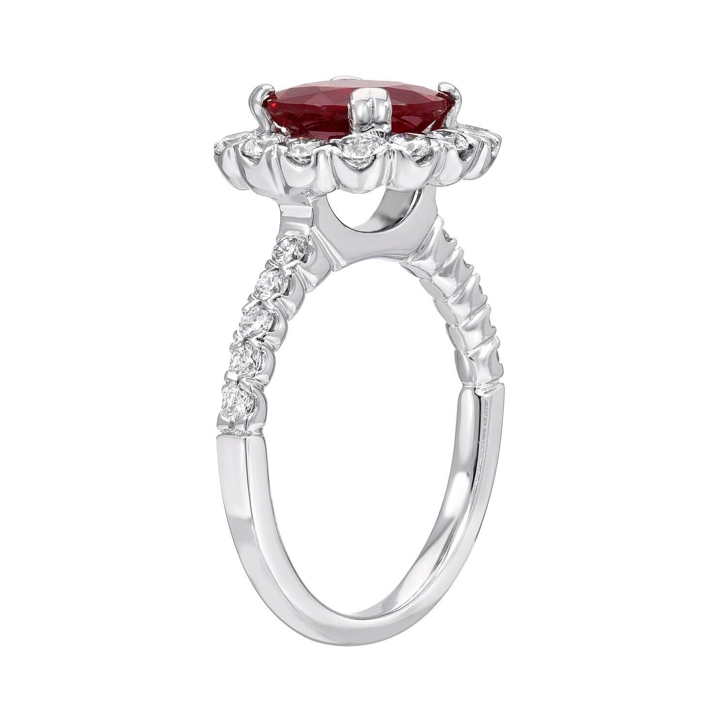 Classic intense-red Ruby round, weighing a total of 2.53 carats, is adorned by a total of 0.78 round brilliant diamonds in this 18K white gold engagement ring or cocktail ring. 
The C. Dunaigre gem certificate is attached to the images for your