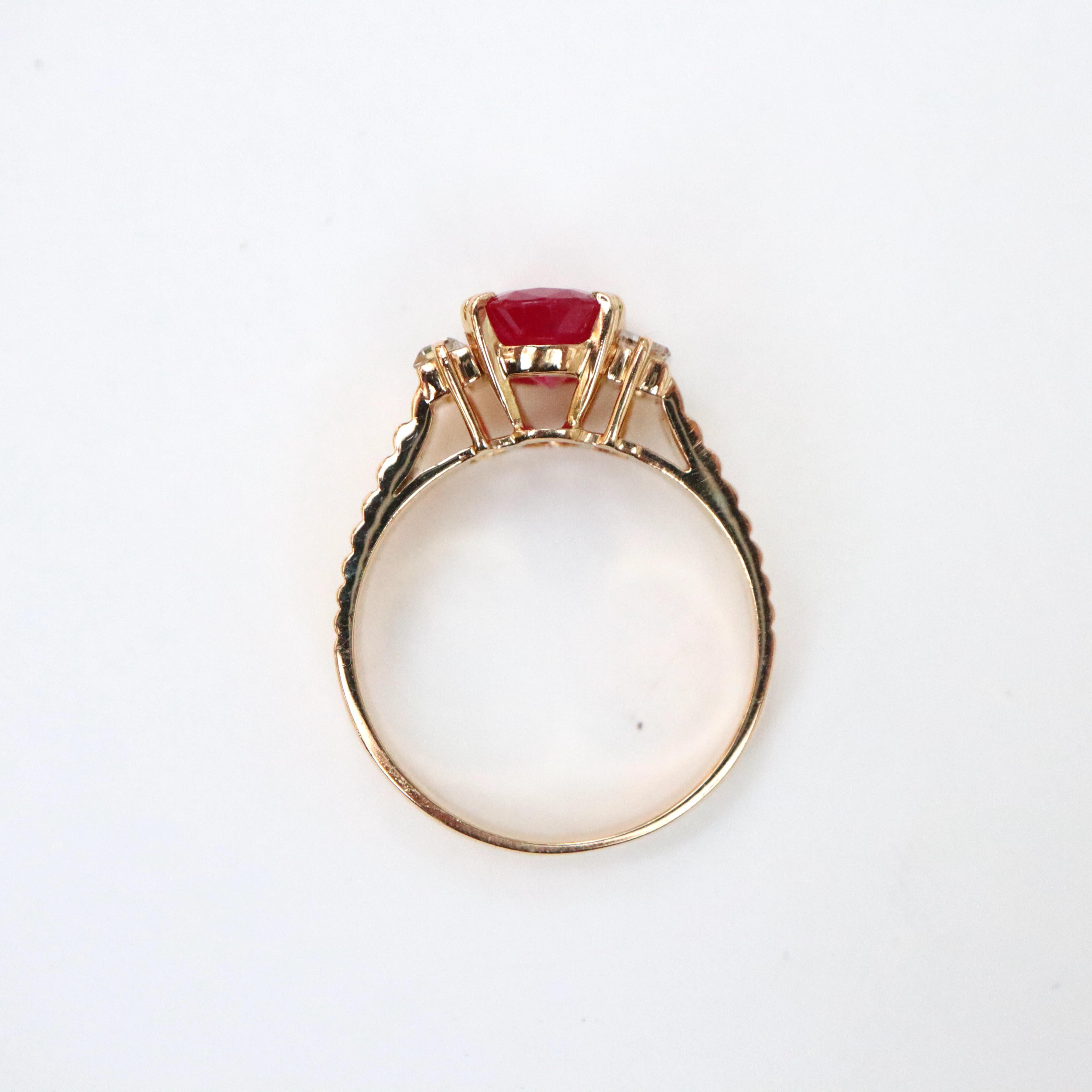Oval Cut Ruby Ring Ruby 2.3 Carat in 18 Carat Yellow Gold Baguette Diamonds Vintage For Sale