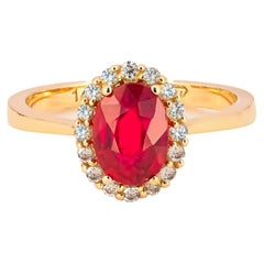 Ruby ring with diamond halo. 