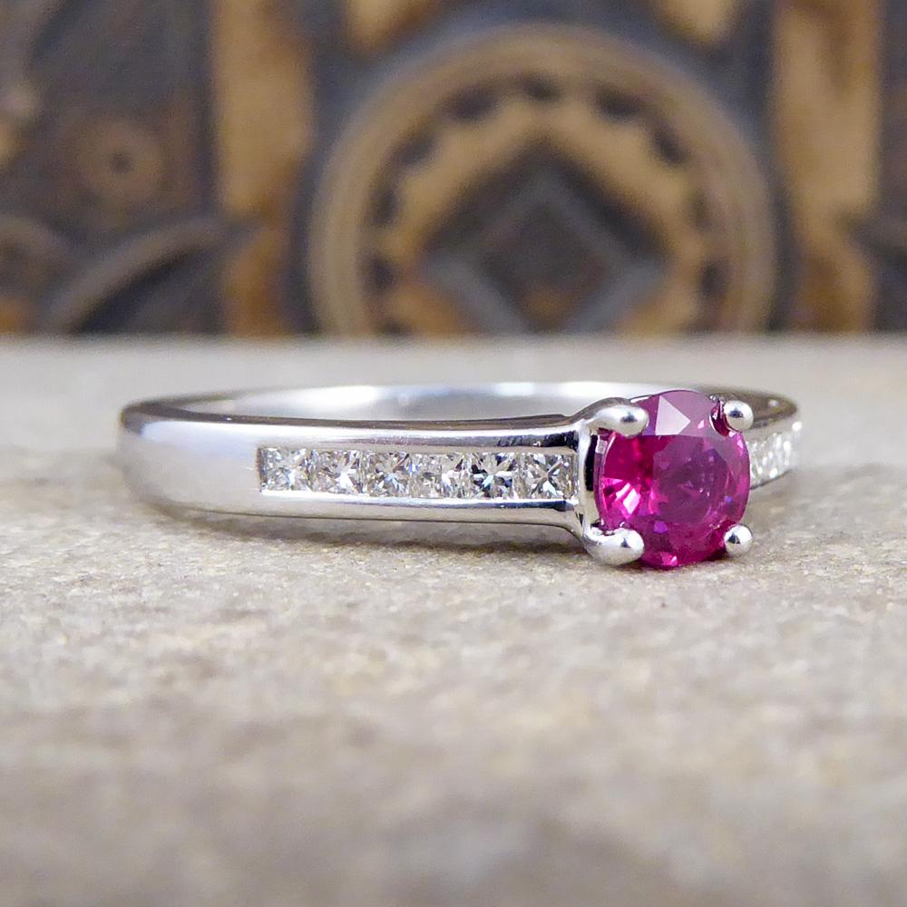Lovely Contemporary Ruby and Diamond gemstone ring. This pristine and fashionable ring has been crafted in 18ct White Gold creates a luxurious contrast with the Ruby gemstone weighing 0.35ct, with such a deep and alluring red. Highlighting and