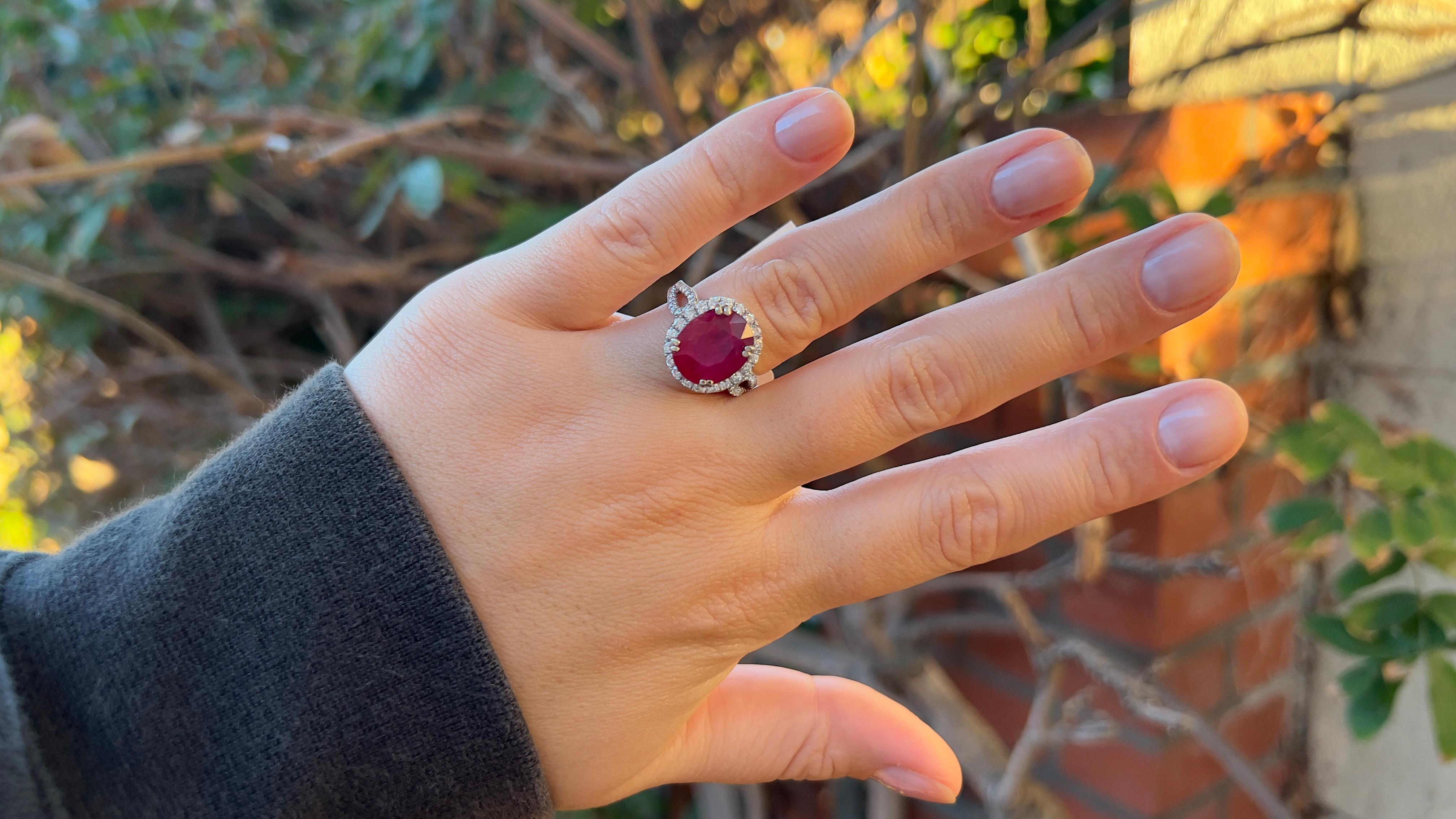 Ruby = 6.50 Carats
(Cut: Oval, Color: Red, Origin: Natural)
Diamond = 1.20 Carats
(Cut: Round; Color: F-G, Clarity: VS)
Metal = 18K White Gold
Ring Size = 6.5