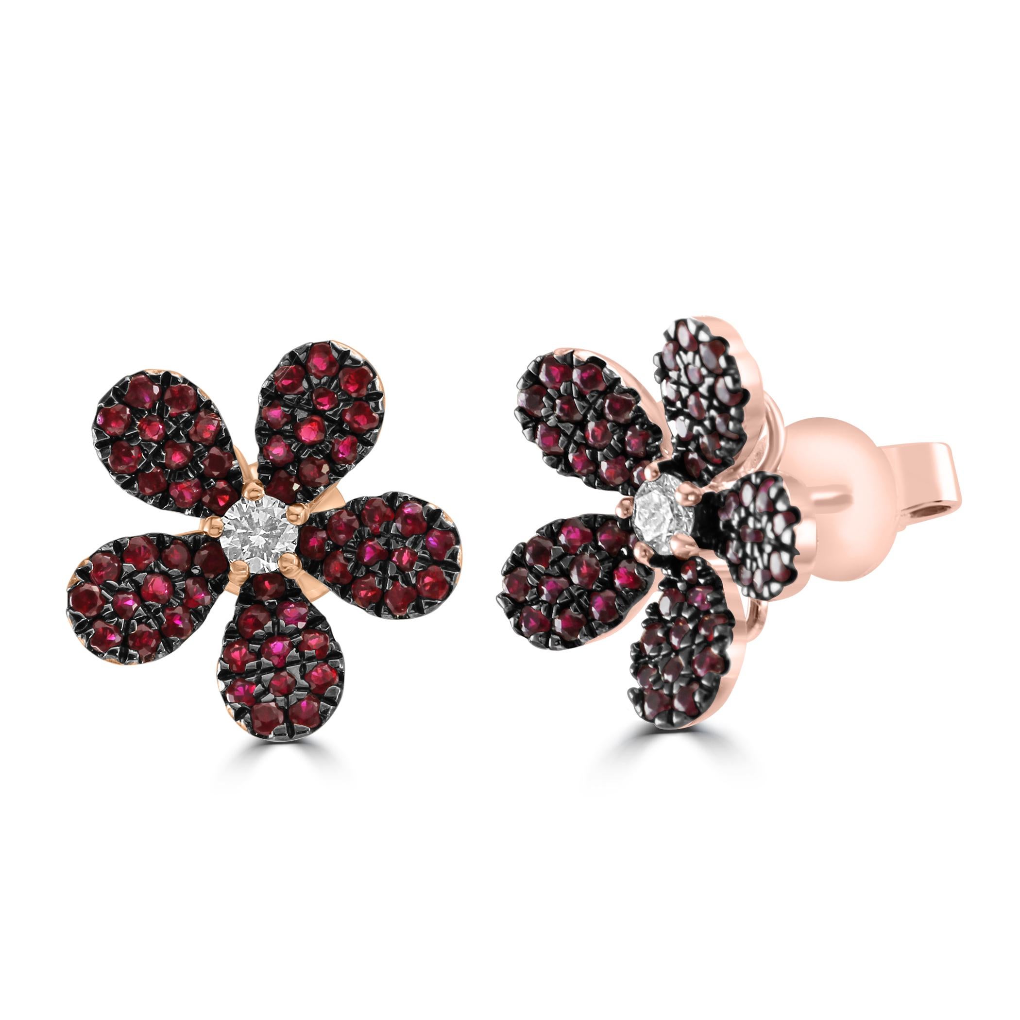 Behold our flower-shaped earrings, a true floral masterpiece that blooms with the vibrancy of 110 captivating Ruby stones totaling to 1.37 carats. Nestled at the heart of this floral arrangement is a single, brilliant White Diamond Round, boasting a