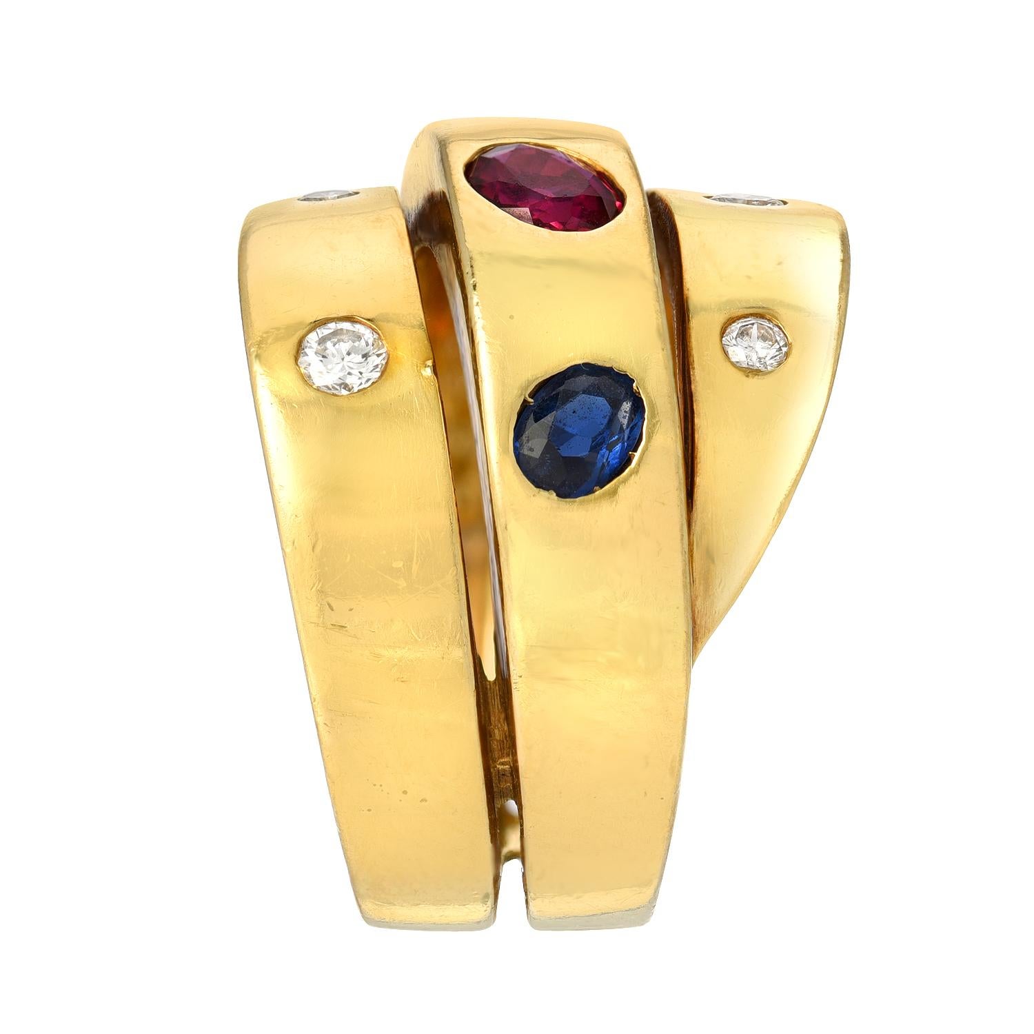 A wrapped design features an oval ruby flanked by oval sapphires on the central element accented with round diamonds totaling approximately 0.15 carat mounted in 18 karat yellow gold, stamped with VCA makers mark, B 5308 63.
Size/Dimensions: US ring