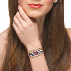 Manschettenarmband mit Rubin und Saphir mit Grill und Diamanten aus 18 Karat Gold