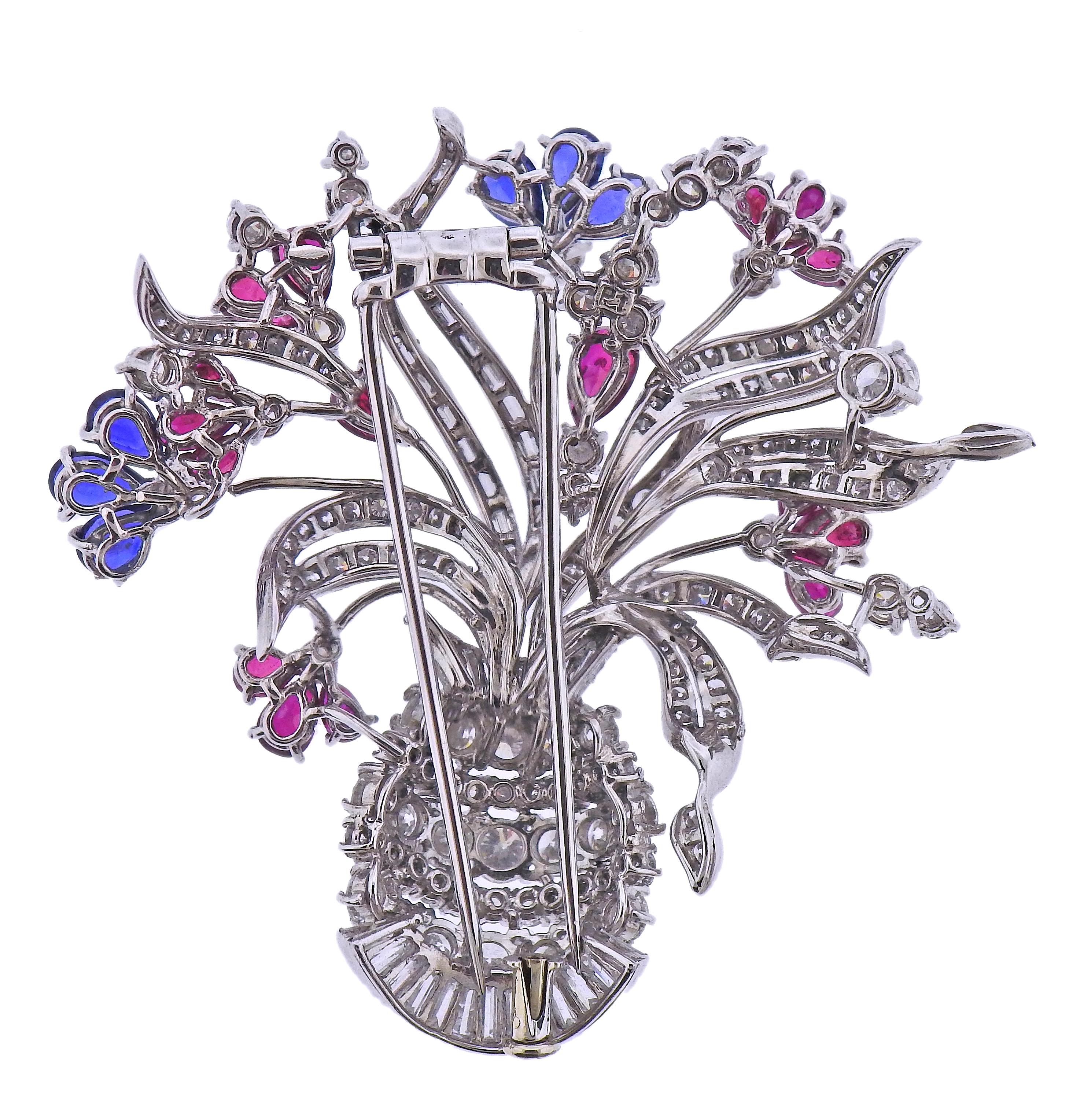 18k white gold flower basket brooch, adorned with vivid sapphires and rubies, as well as approx. 3.50-4.00ctw in diamonds. Brooch measures 2
