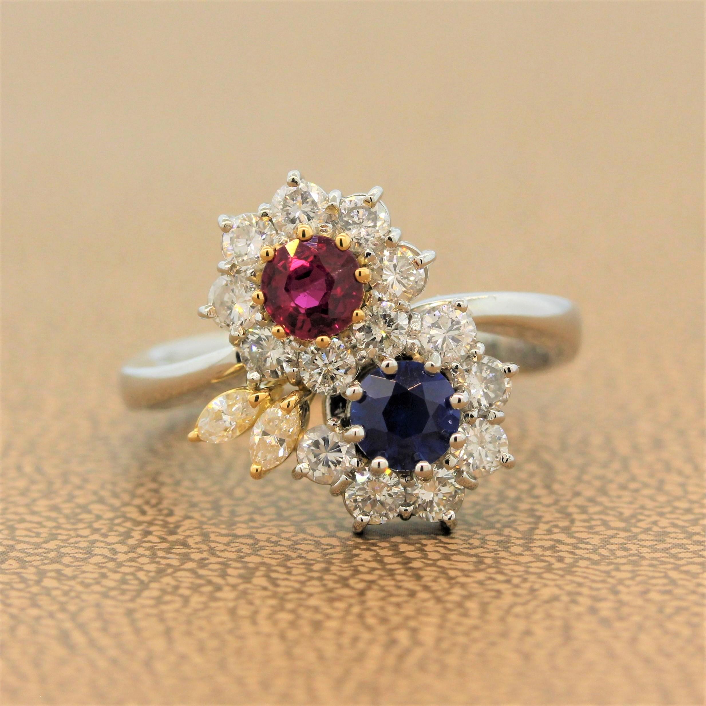 A lovely sweet ring featuring two flowers. One flower has a vivid red ruby center and the other has a royal blue sapphire center weighing a total of 1.24 carats. The precious gemstones are accented by 0.85 carats of round cut diamonds in a platinum