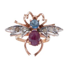 Bague « Fly » en rubis, saphir, diamants, or rose et argent.